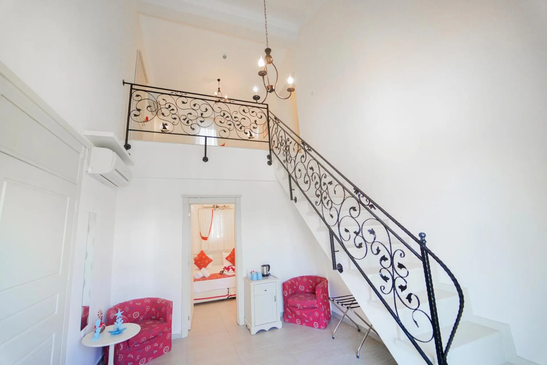 Living room, Bed in Alacati Marina Palace