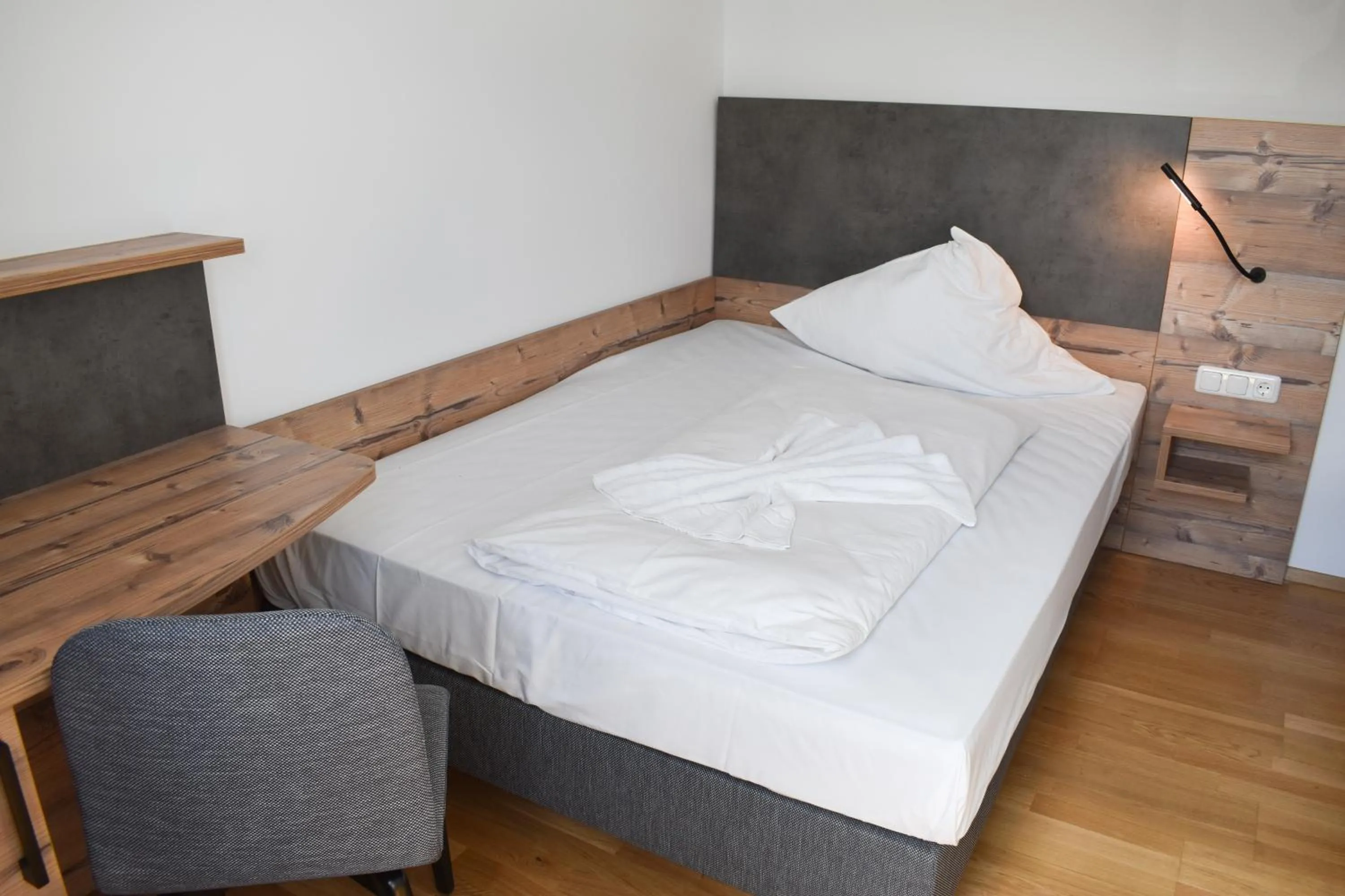 Bed in Winzerhaus Gärtner - An der Loreley