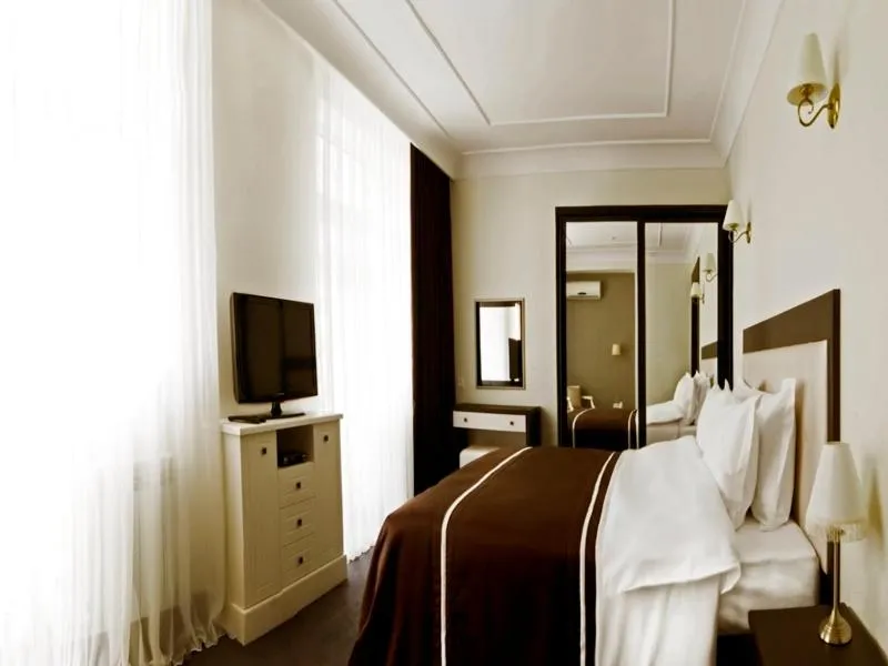 Bed in Villa Rossa Hotel