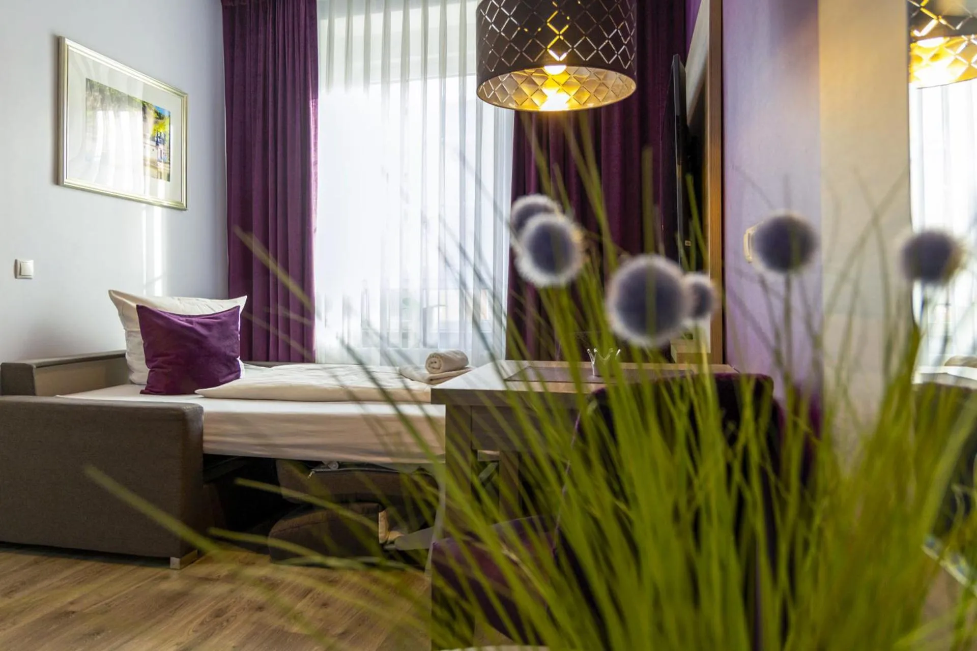 Bed in Apartmenthaus Burgenheimat in Rhens bei Koblenz