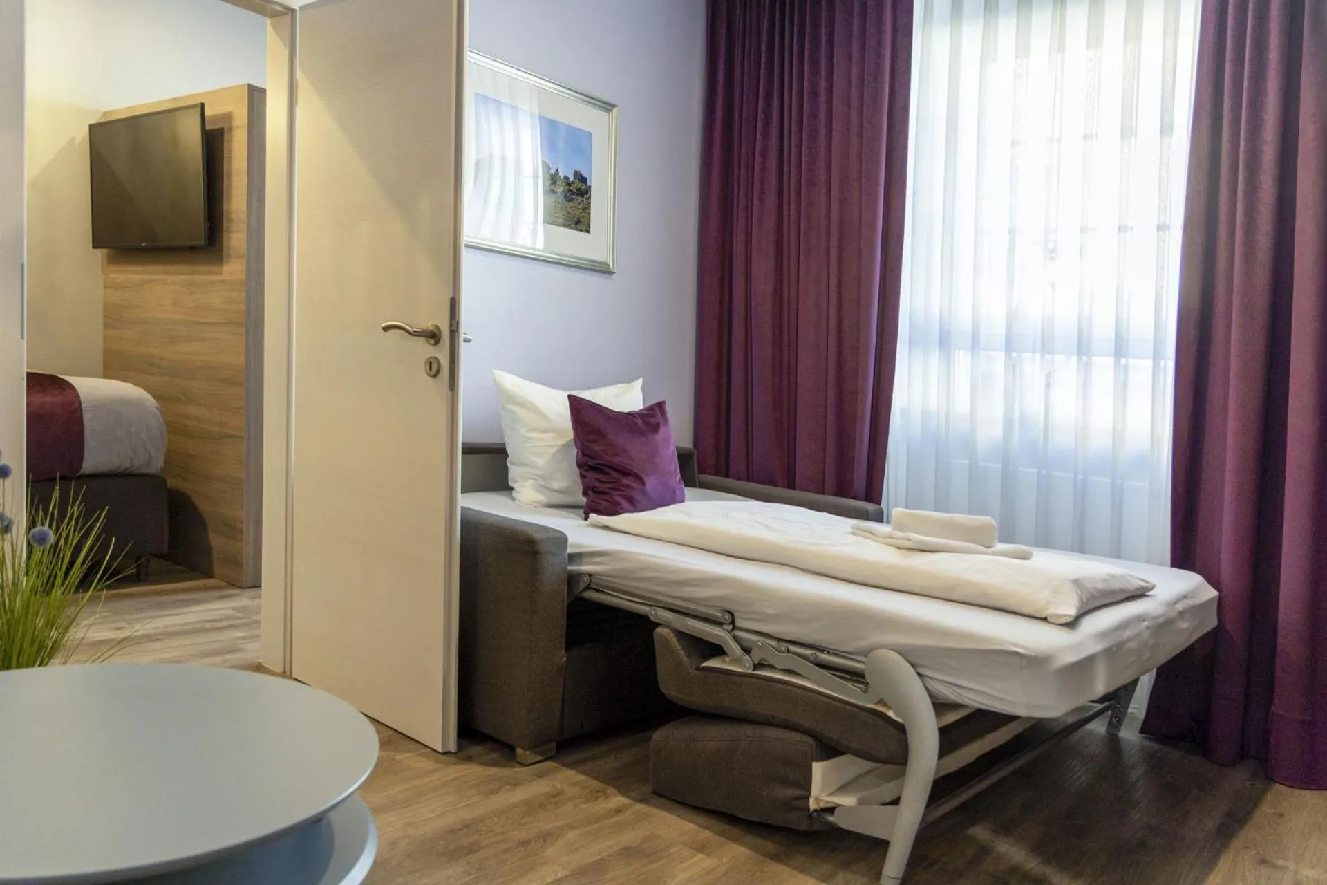 Bed in Apartmenthaus Burgenheimat in Rhens bei Koblenz