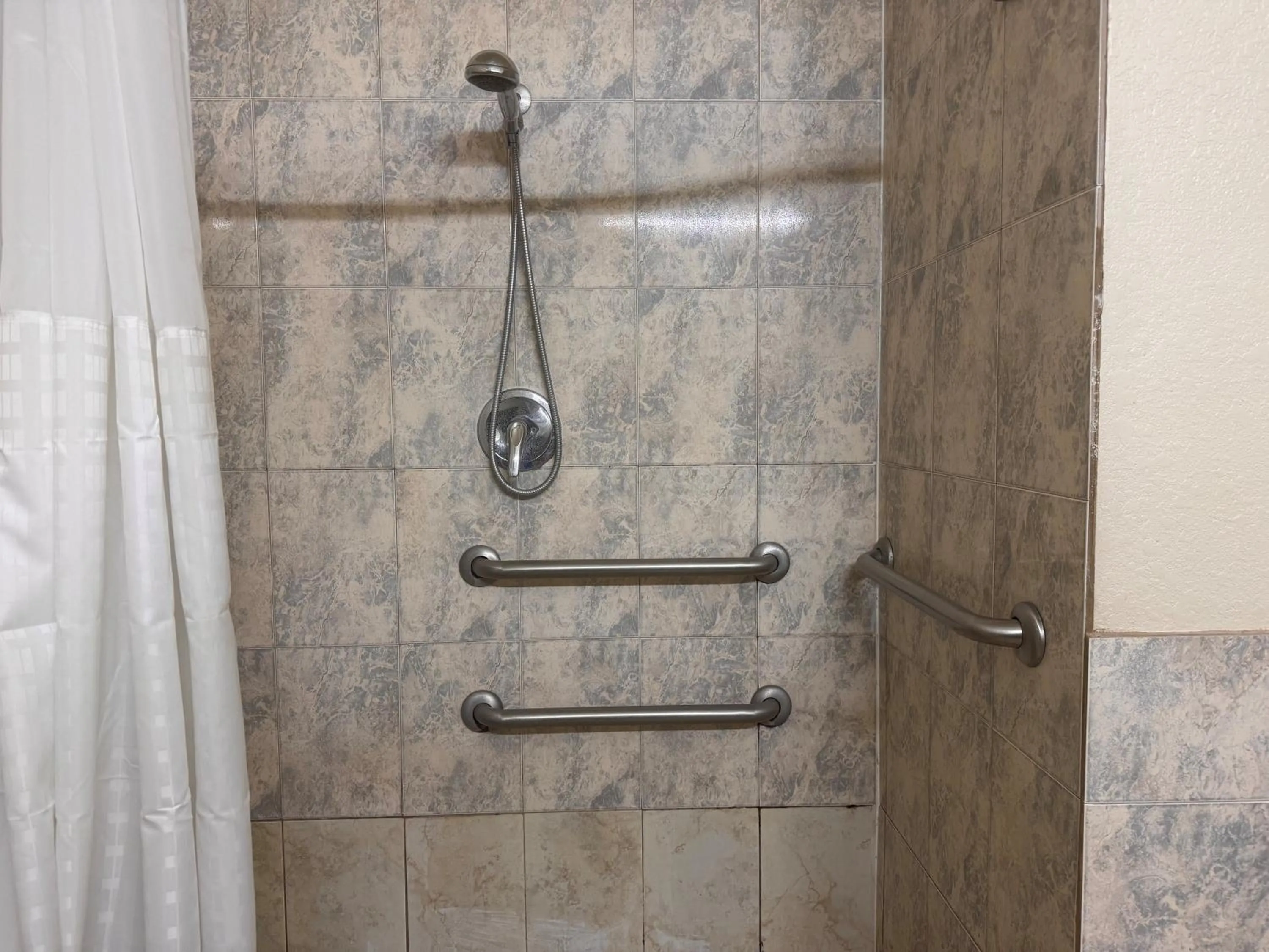 Bathroom in Super 8 by Wyndham Brookshire TX