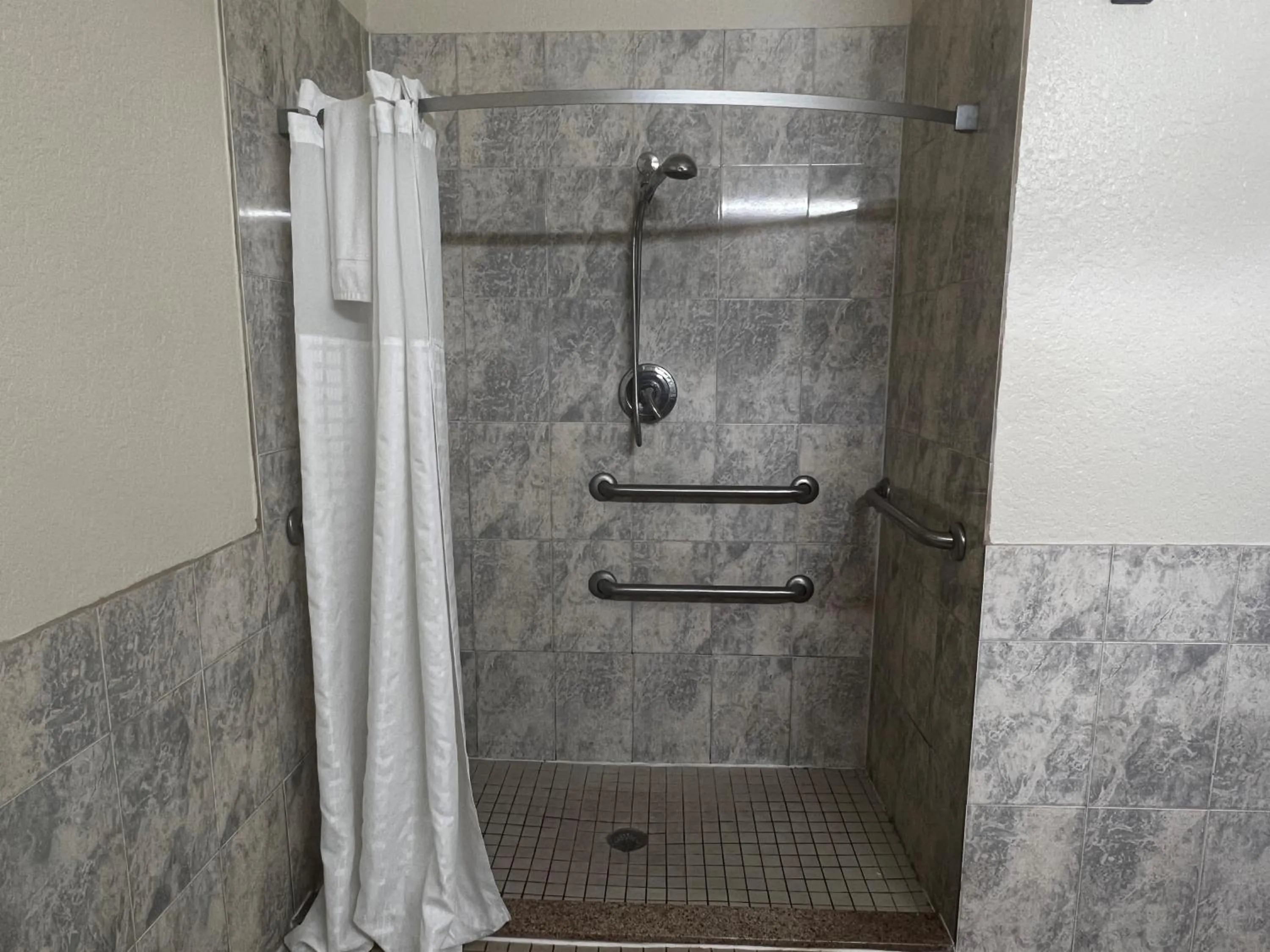 Bathroom in Super 8 by Wyndham Brookshire TX