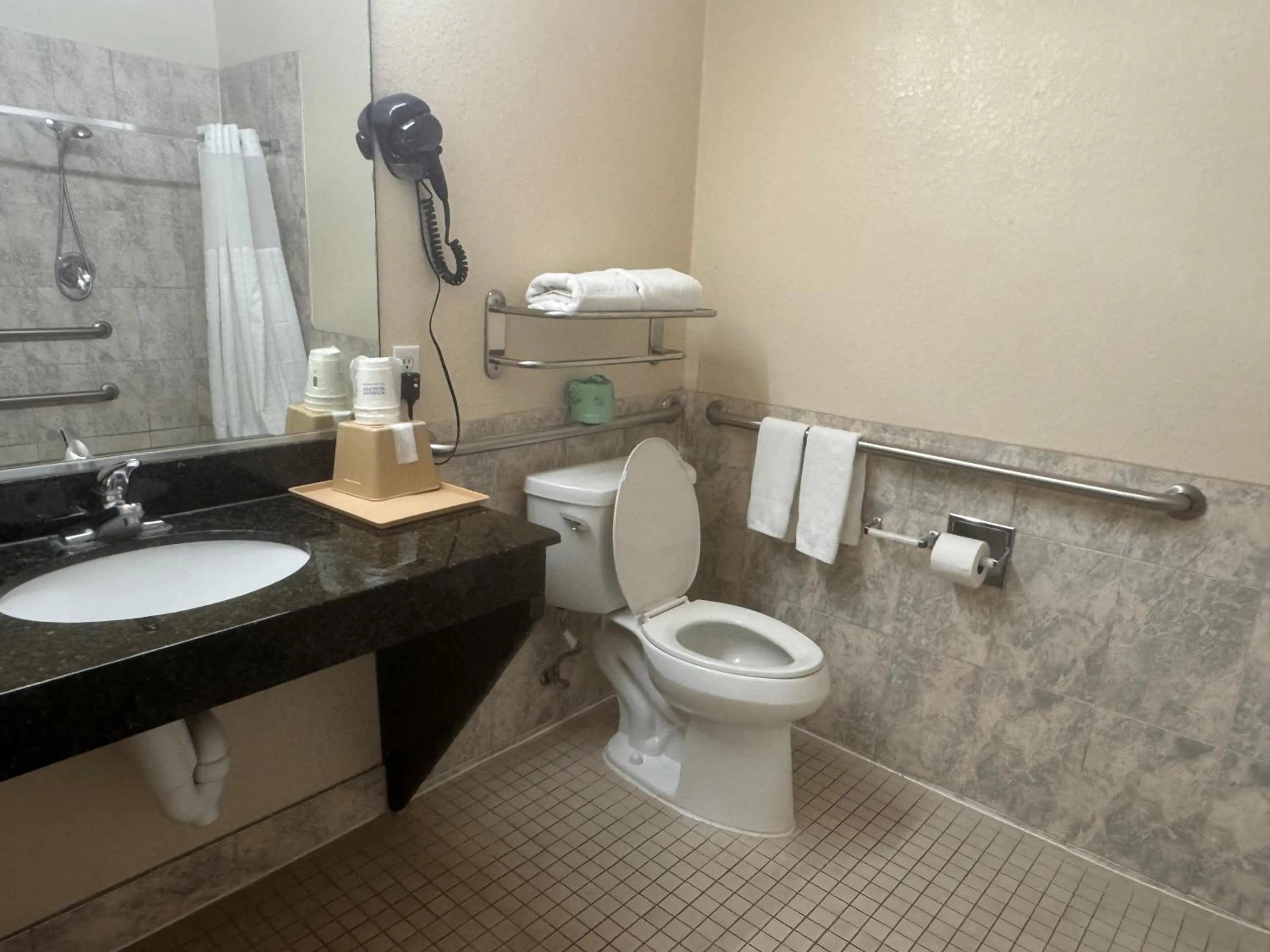 Bathroom in Super 8 by Wyndham Brookshire TX