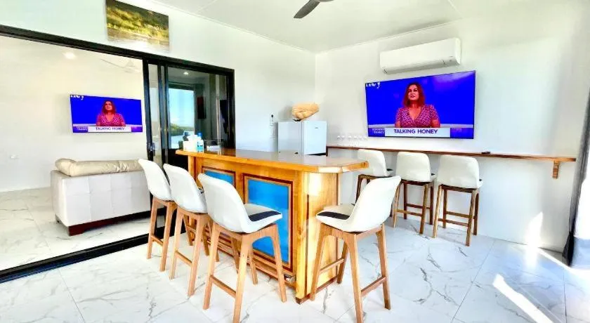 Communal lounge/ TV room in Hinchinbrook Resorts Management Pty Ltd