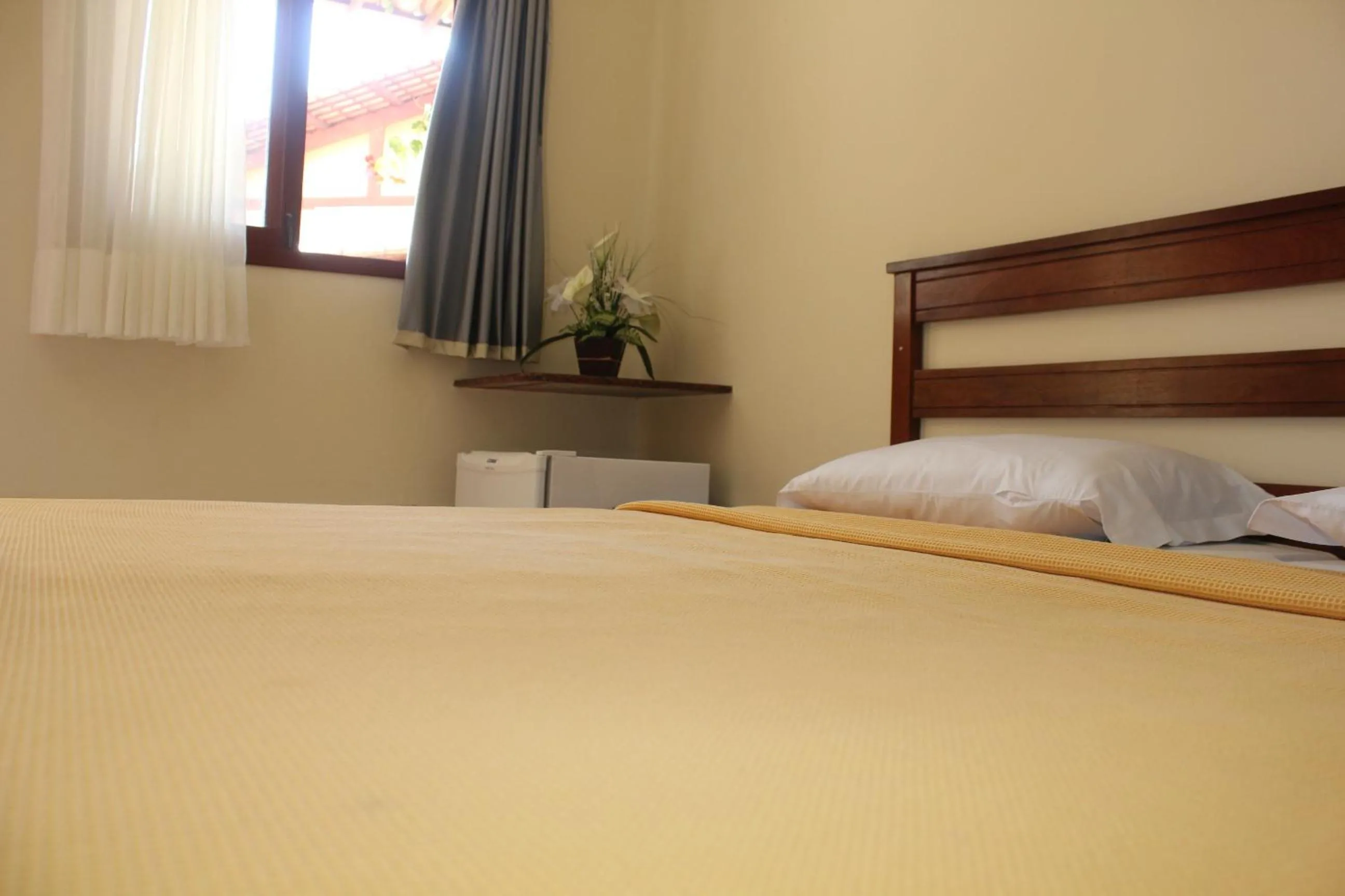 Bed in Pousada Corais do Sul