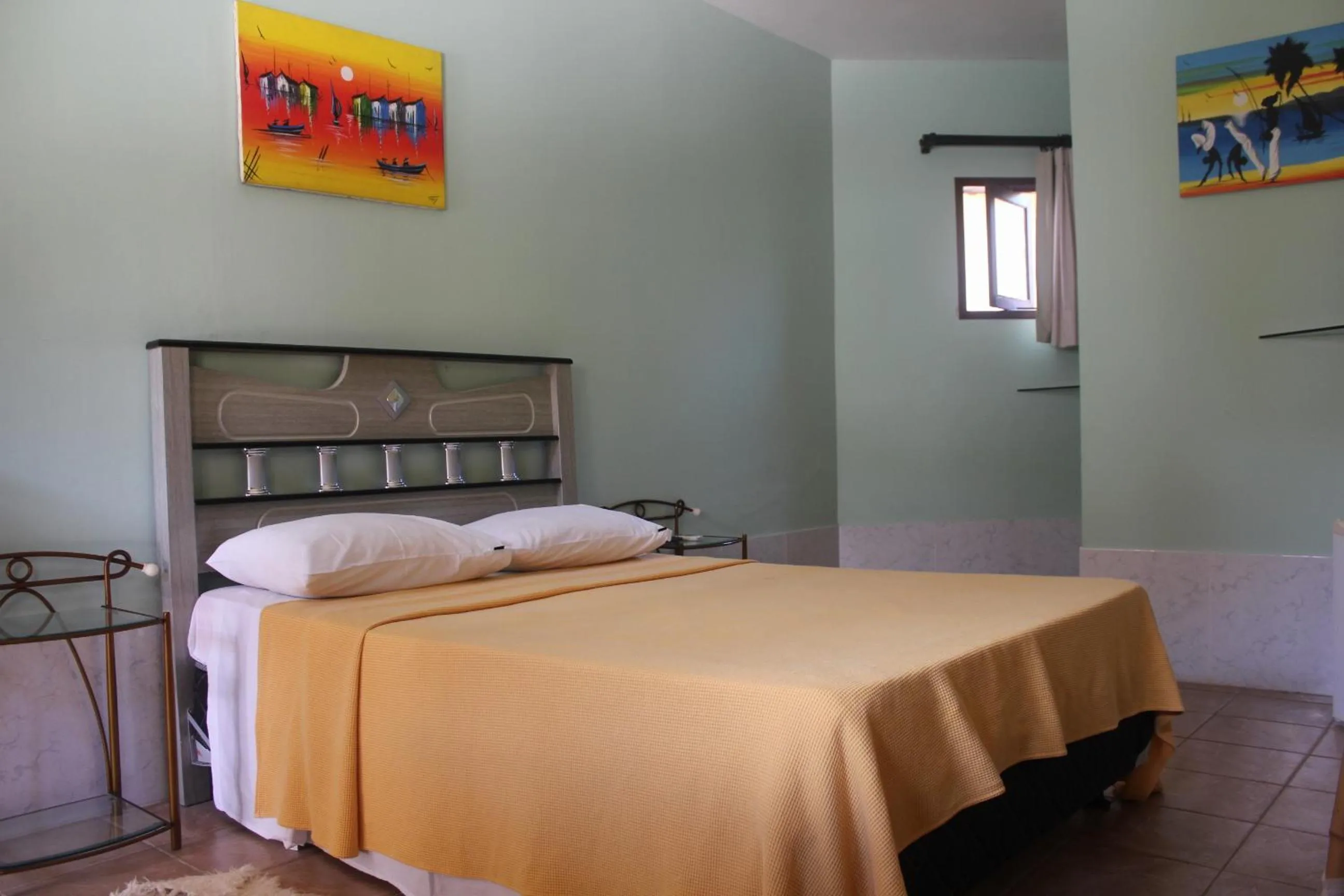 Bed in Pousada Corais do Sul