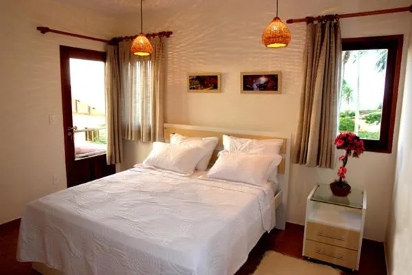 Bed in Pousada Corais do Sul
