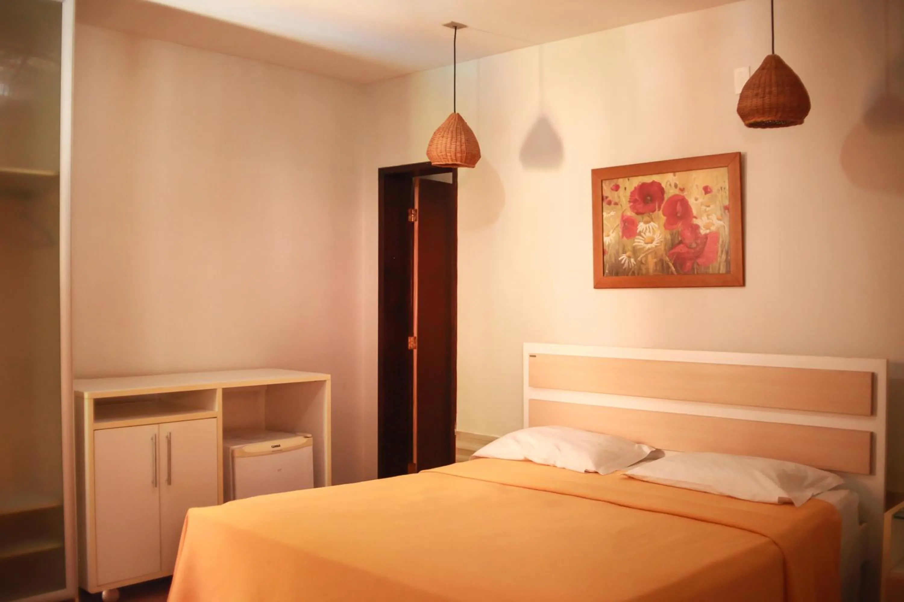 Bed in Pousada Corais do Sul