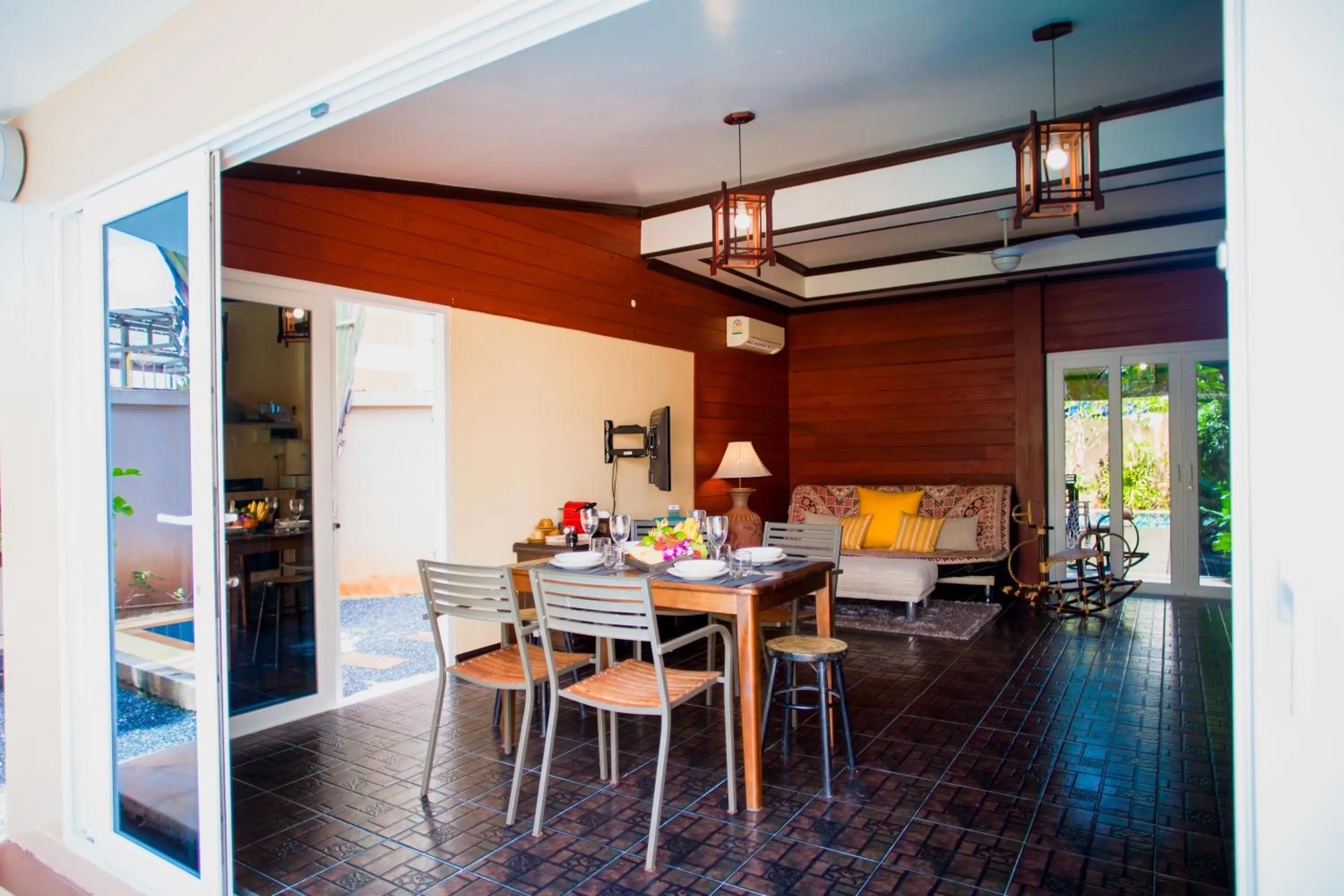 Dining area in Baan Manuchang Villa, SHA Certified