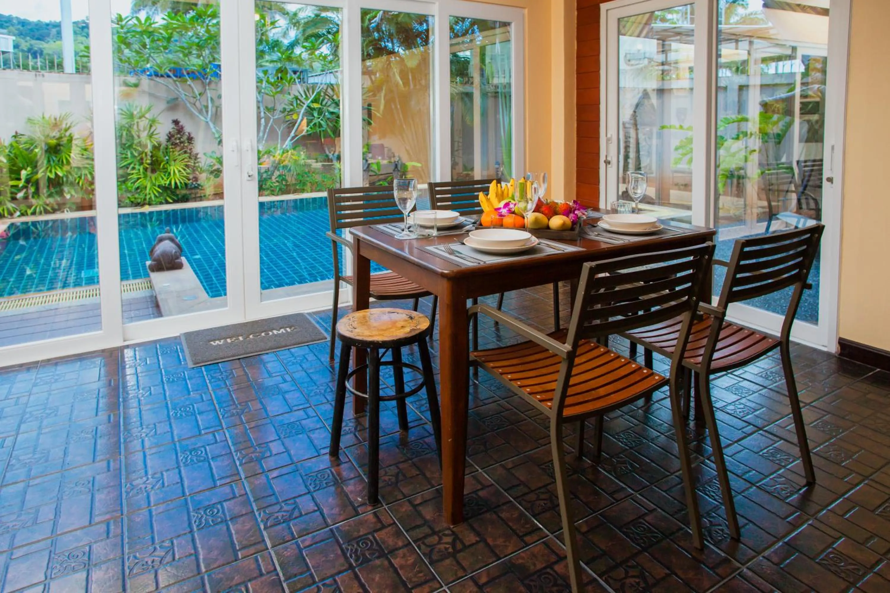 Dining area in Baan Manuchang Villa, SHA Certified