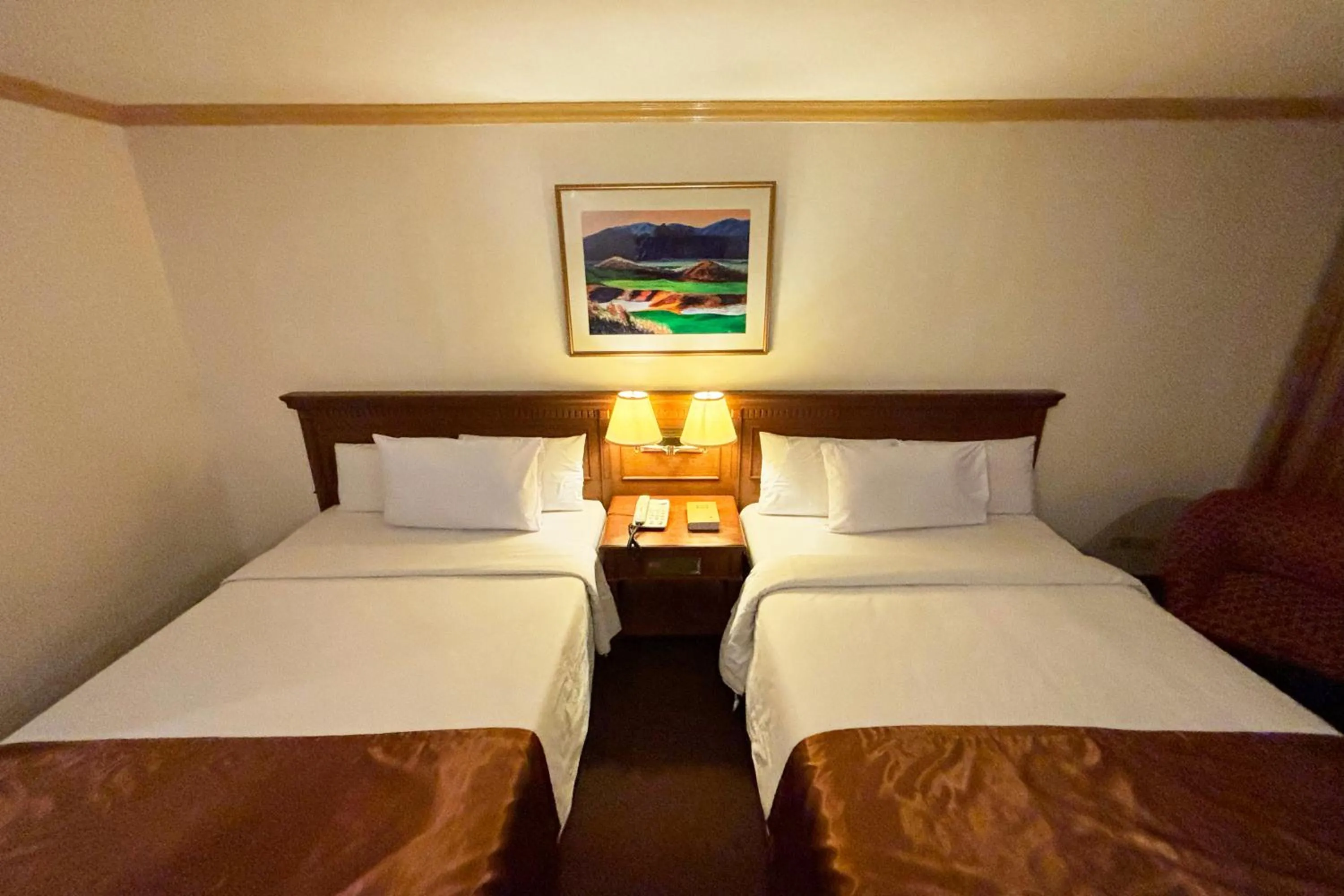 Bed in Tiara Oriental Hotel Makati powered by Cocotel