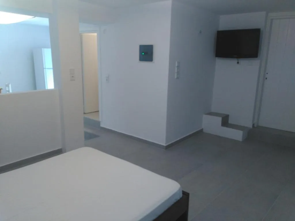 Seating area, Bed in Milos Bay Suites