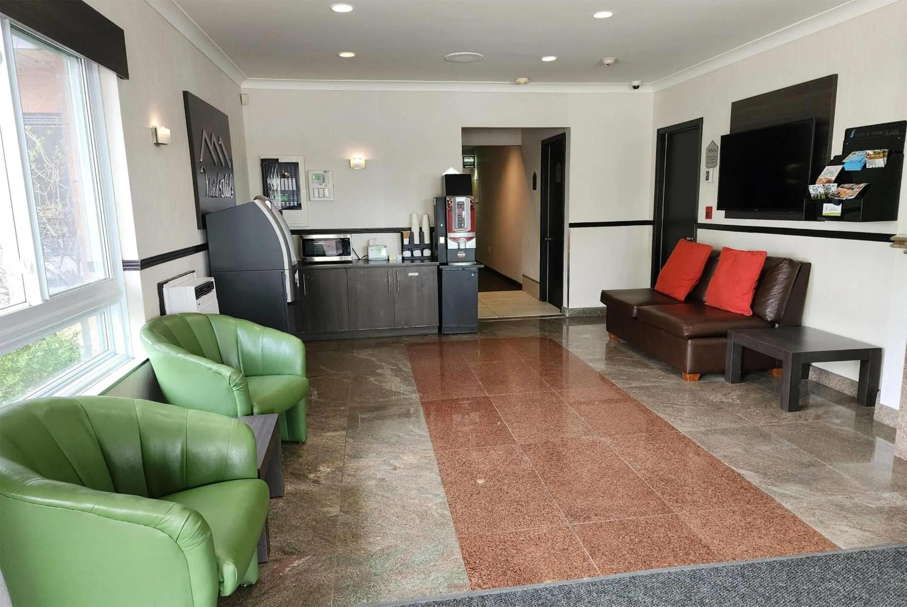 Lobby or reception in Ramada by Wyndham Laval Lobby or reception in Ramada by Wyndham Laval