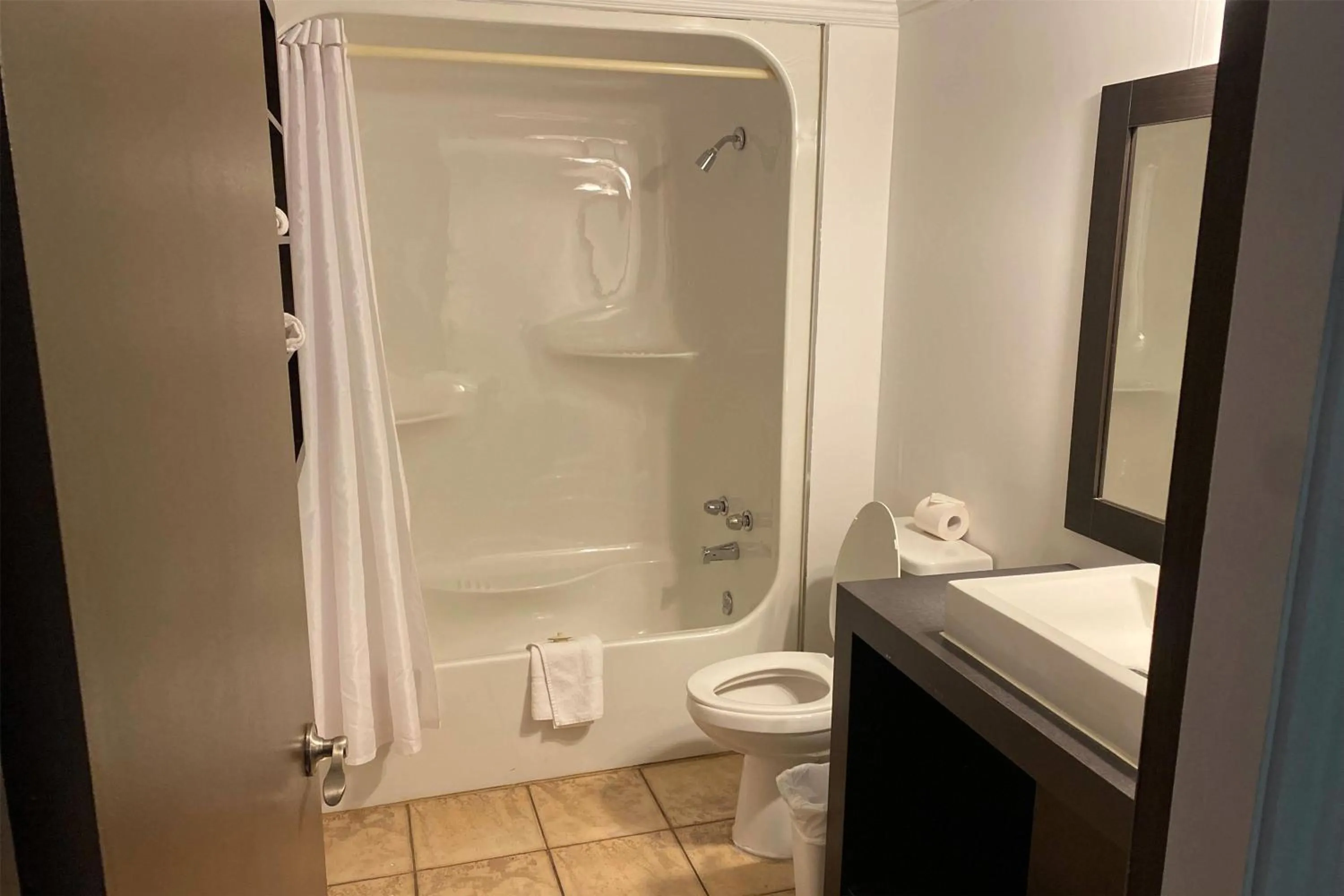 Bathroom in Ramada by Wyndham Laval