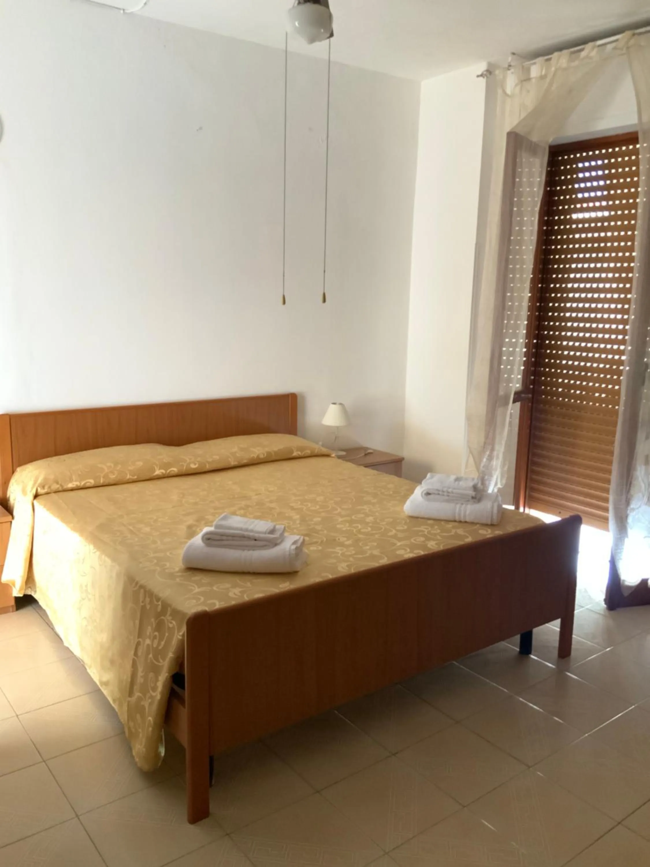 Bed in La Scogliera Bed & Breakfast