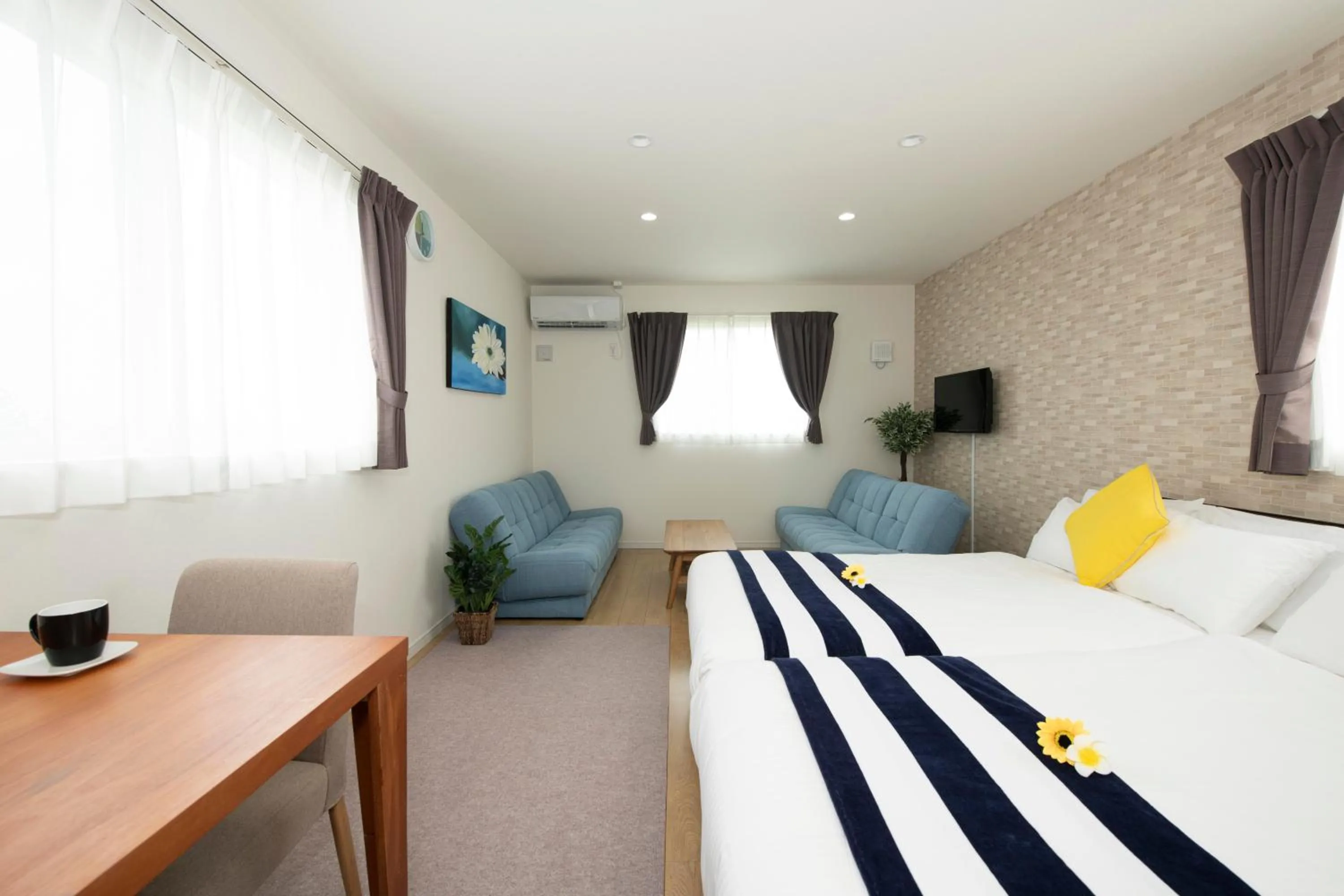 Living room, Bed in Palm Springs Miyakojima Resort