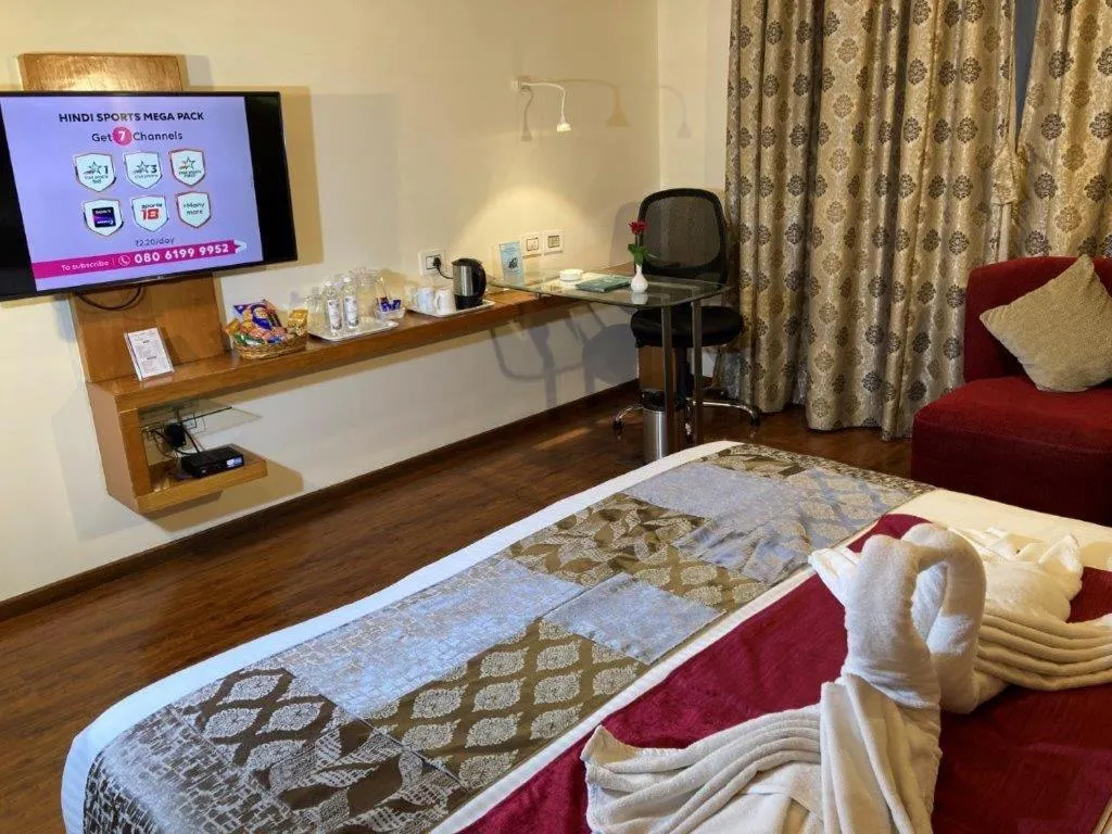 Photo of the whole room, Bed in Hotel Ramanashree Richmond