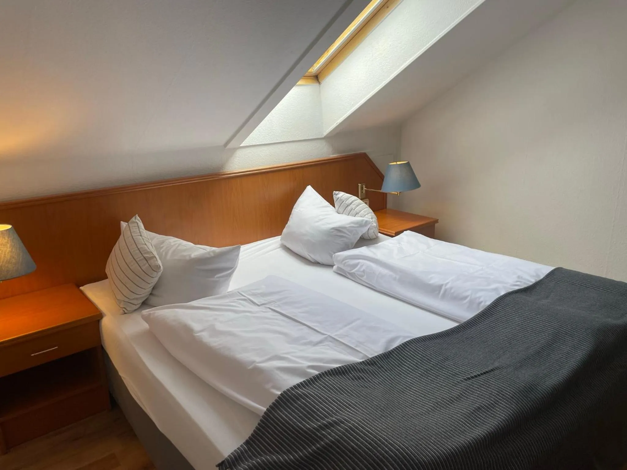 Photo of the whole room, Bed in Berghotel HARZ