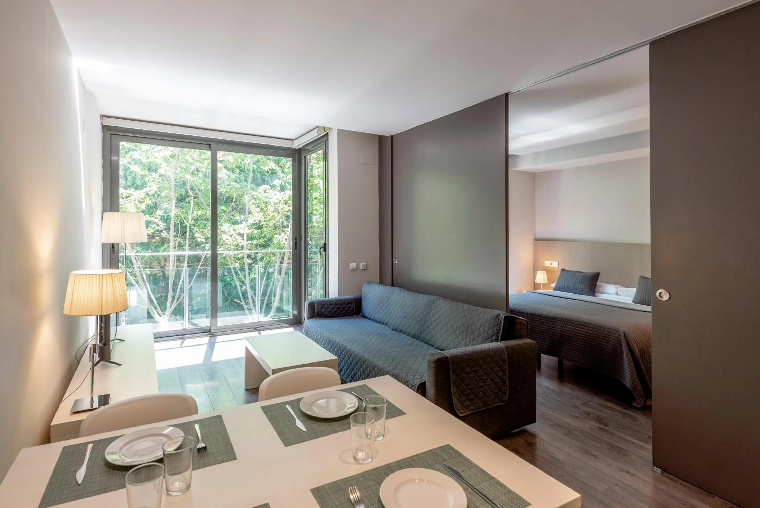 Living room, Bed in Espais Blaus Apartments