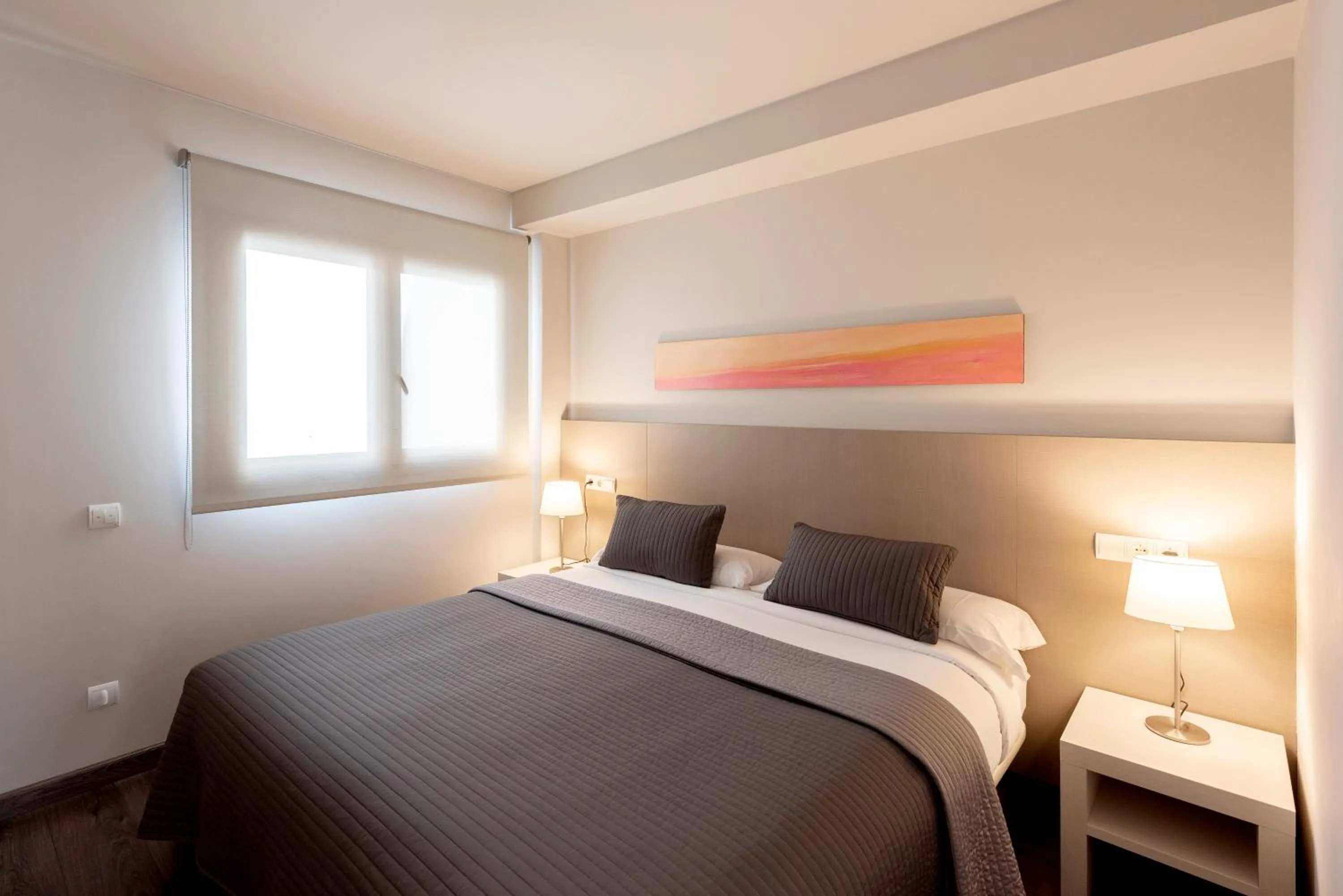Bed in Espais Blaus Apartments