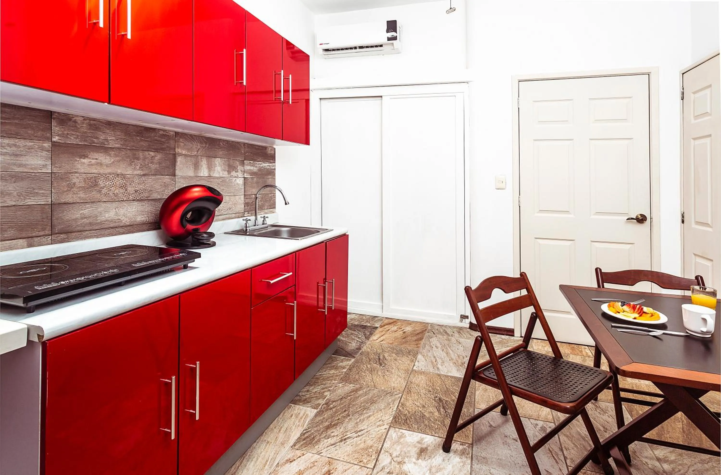 Kitchen or kitchenette in Fabiola Condo Hotel