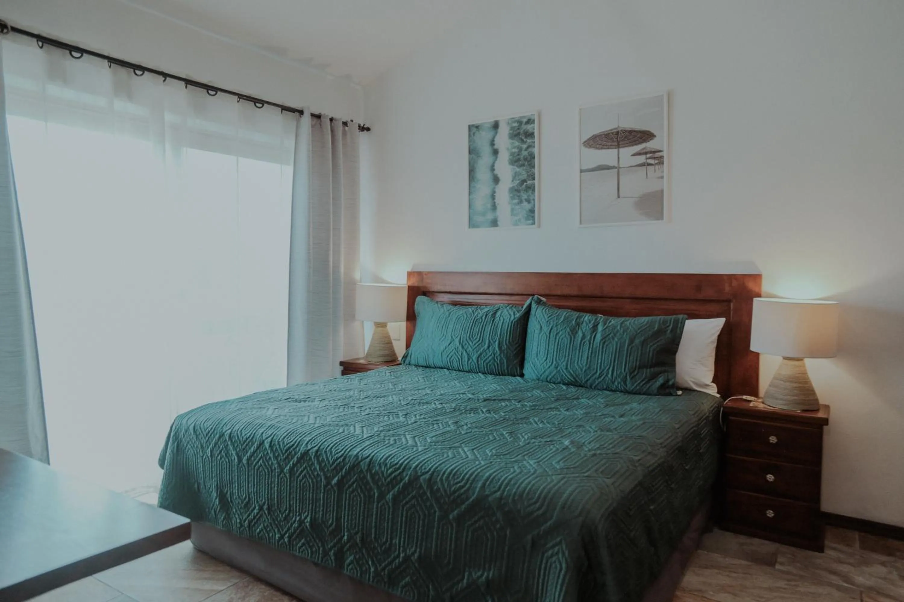 Bed in Fabiola Condo Hotel