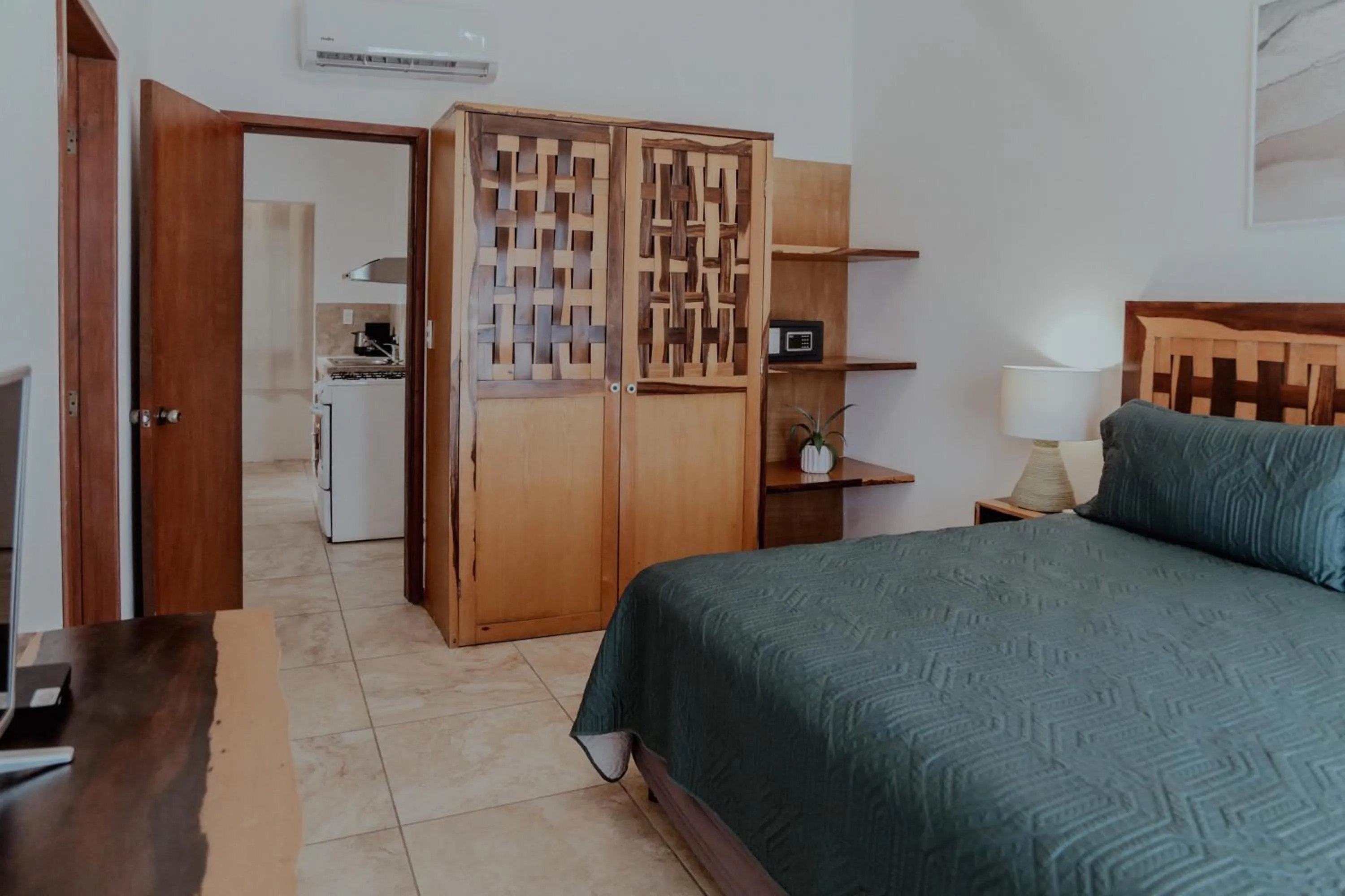 Bed in Fabiola Condo Hotel