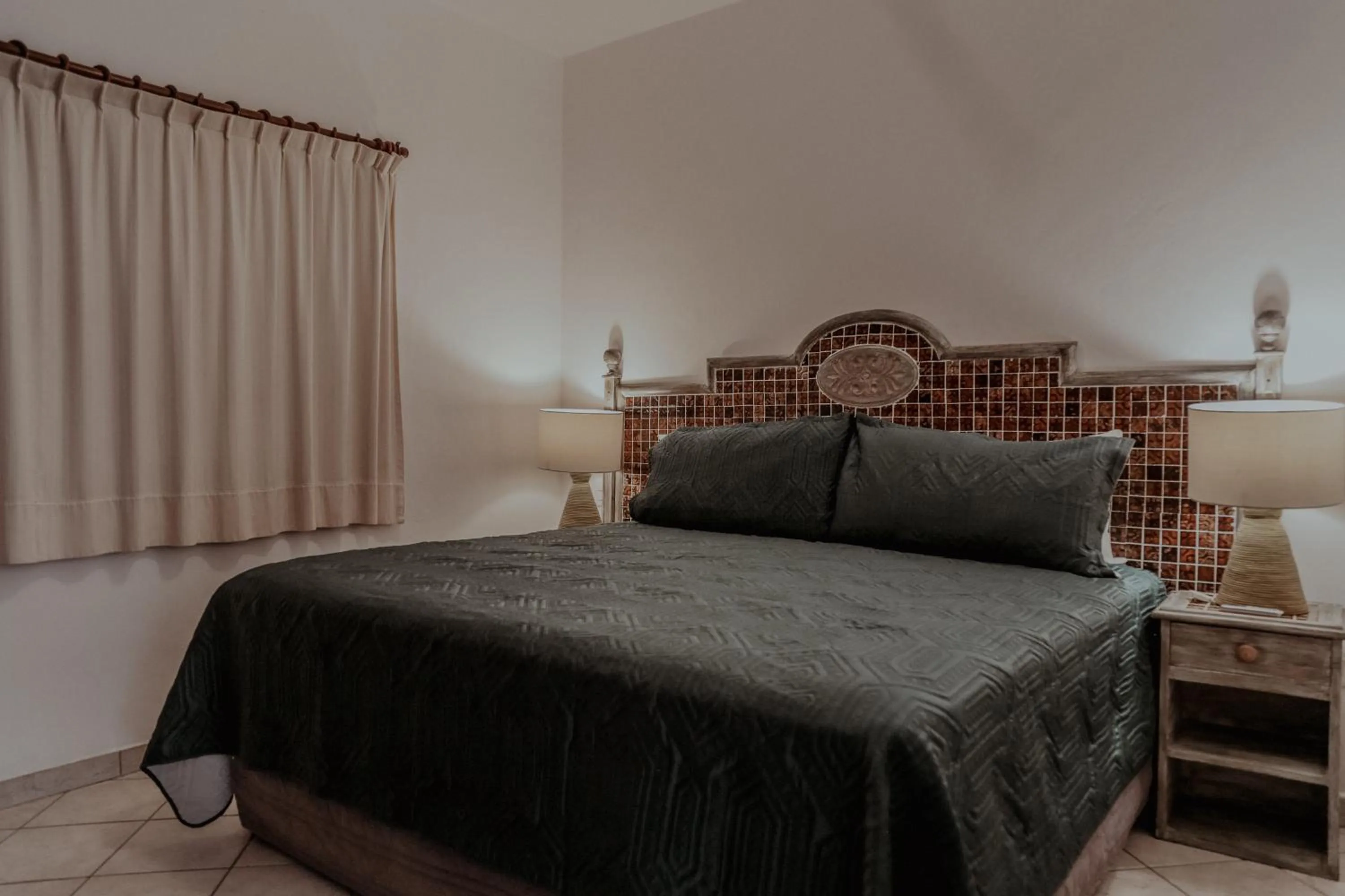 Bed in Fabiola Condo Hotel