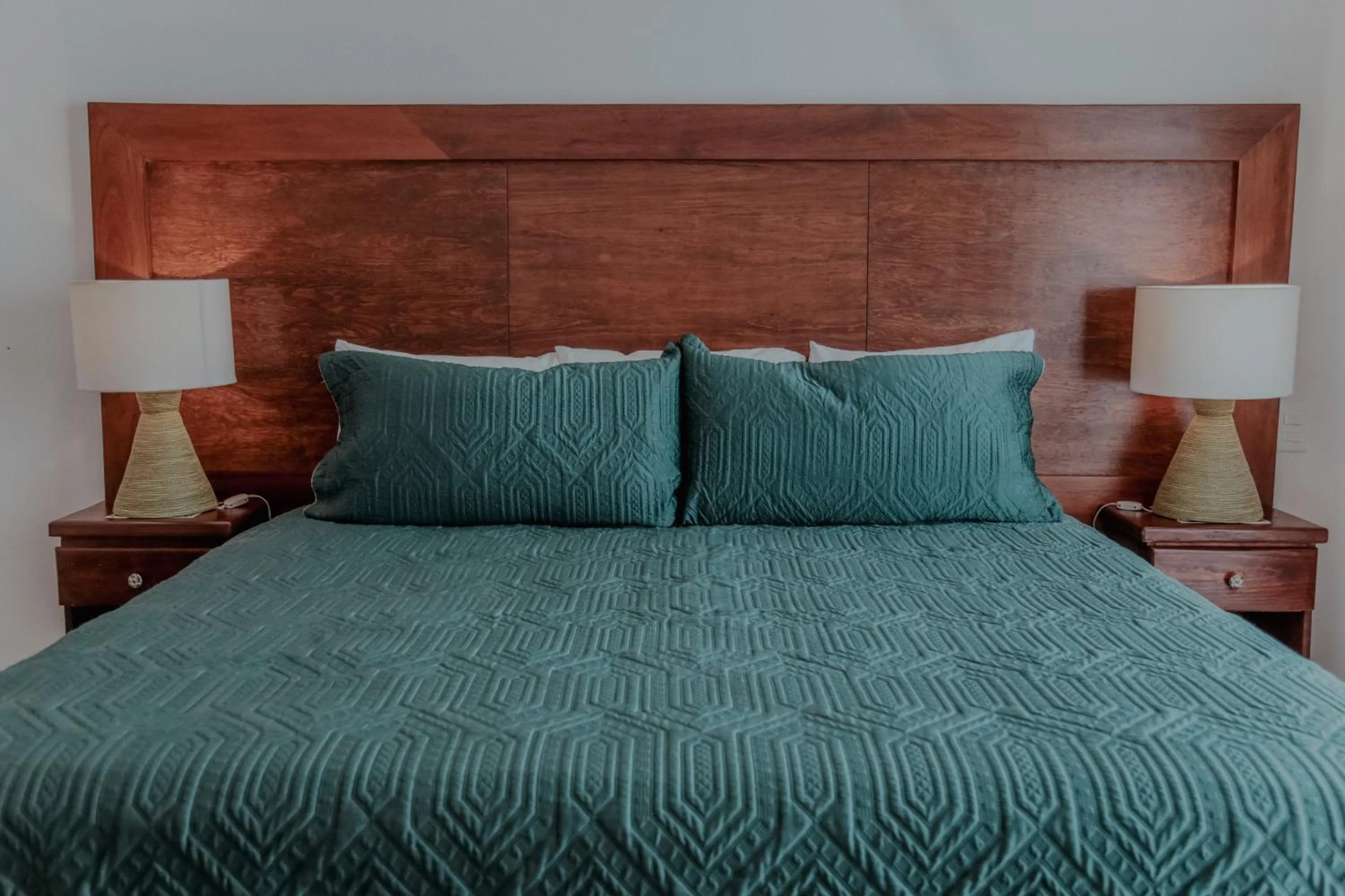 Bed in Fabiola Condo Hotel