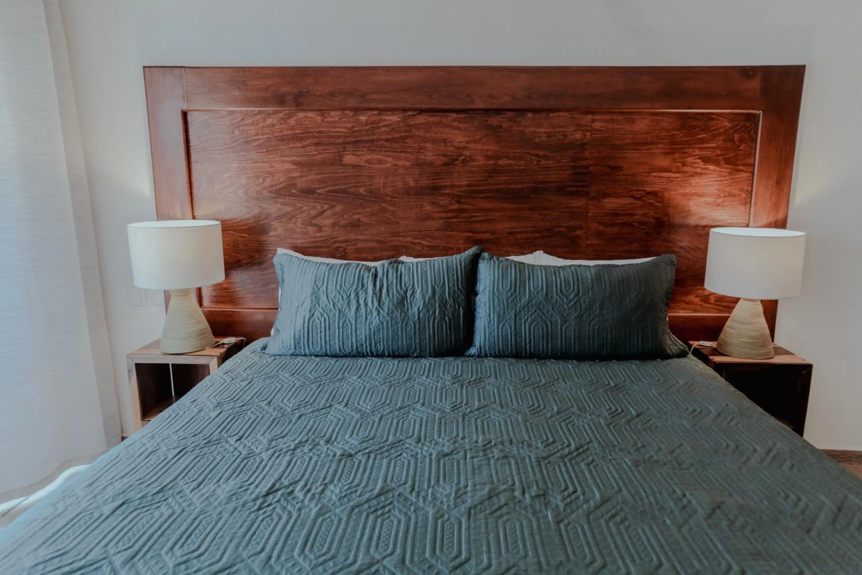 Bed in Fabiola Condo Hotel