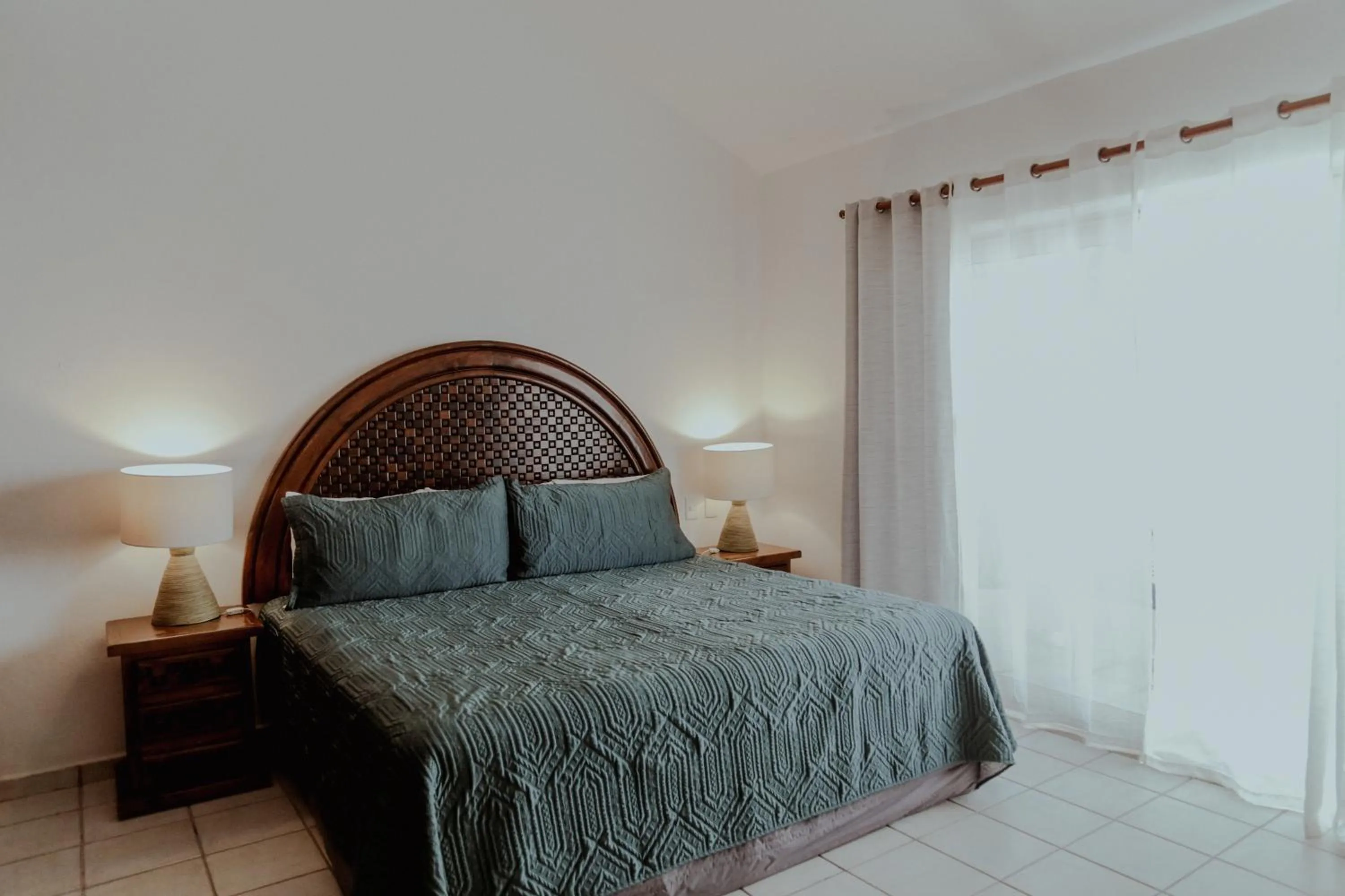 Bed in Fabiola Condo Hotel