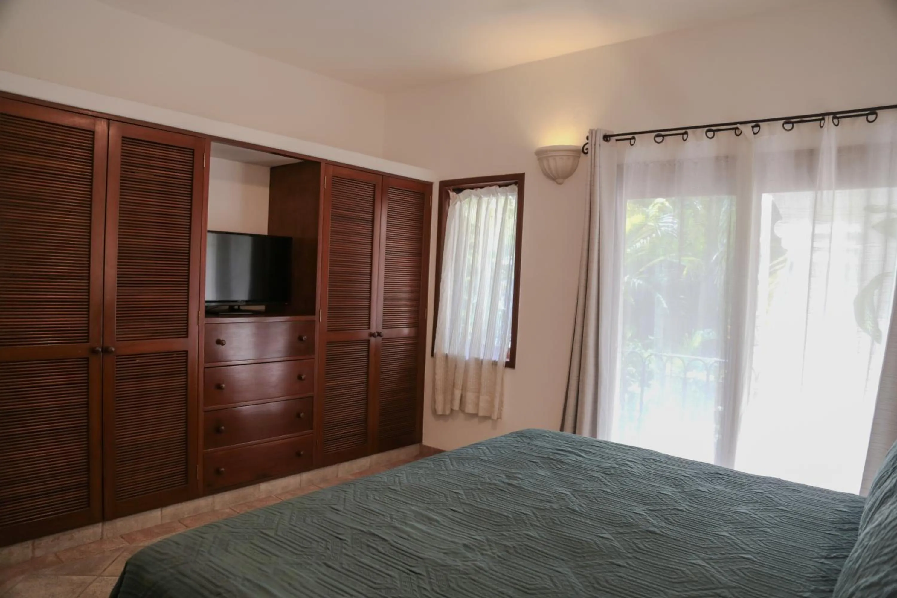 Bed in Fabiola Condo Hotel