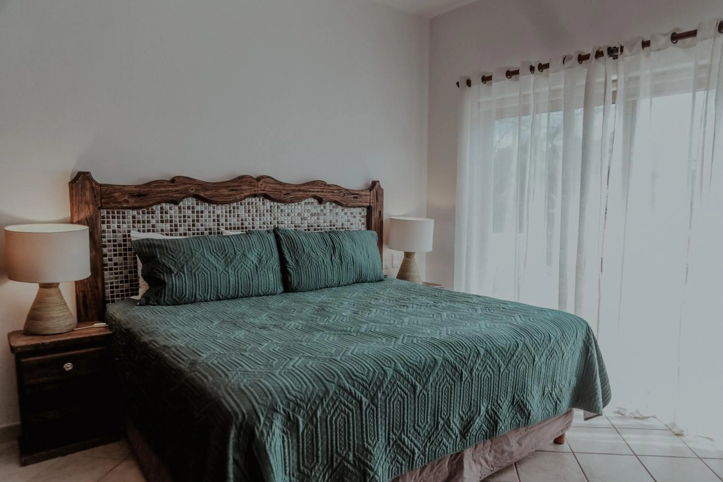 Bed in Fabiola Condo Hotel