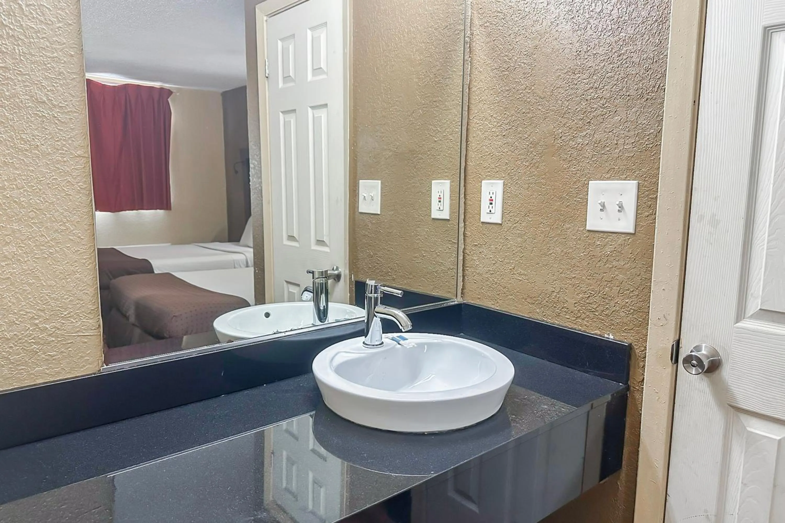 Bathroom in OYO Hotel Mobile, AL I-65 at Airport Blvd