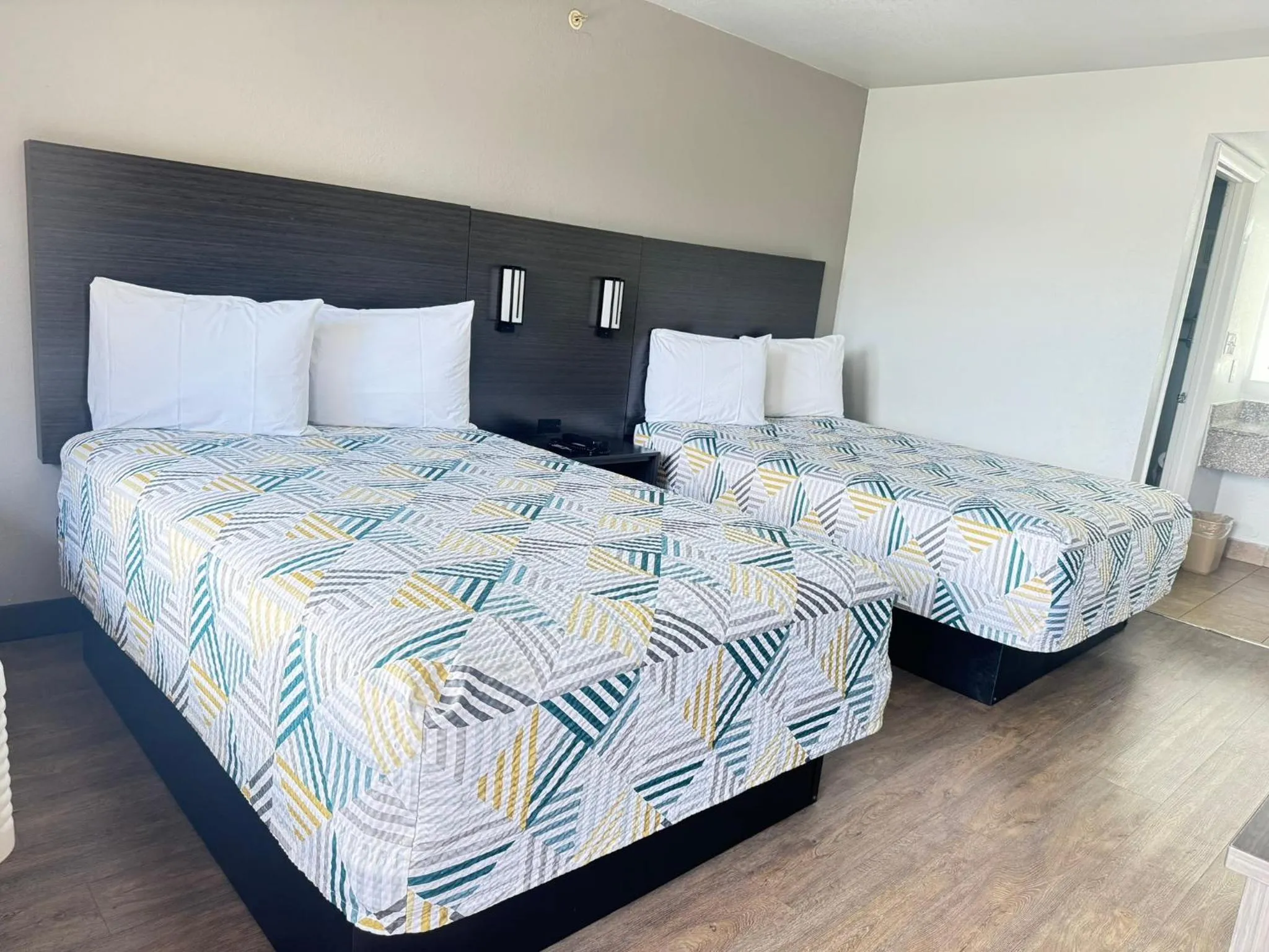 Bed in Masters Inn Tucker