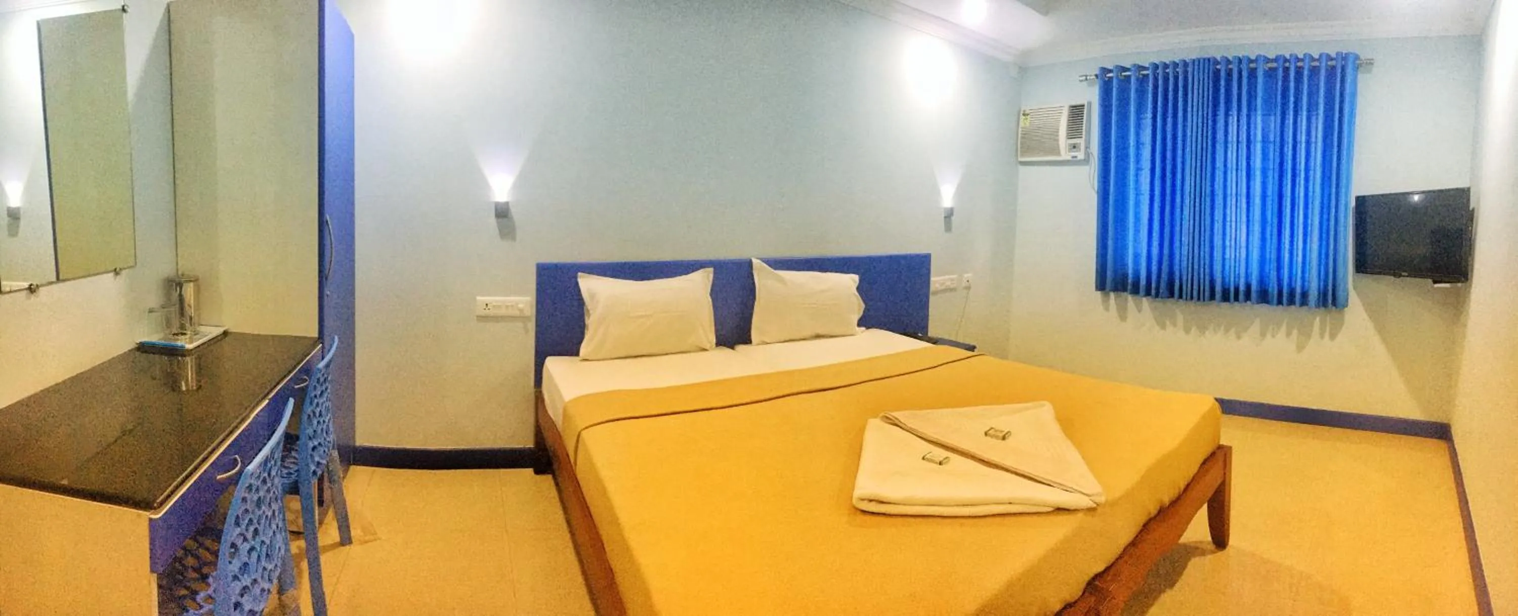 Bed in Kalluvalappil Holiday Inn