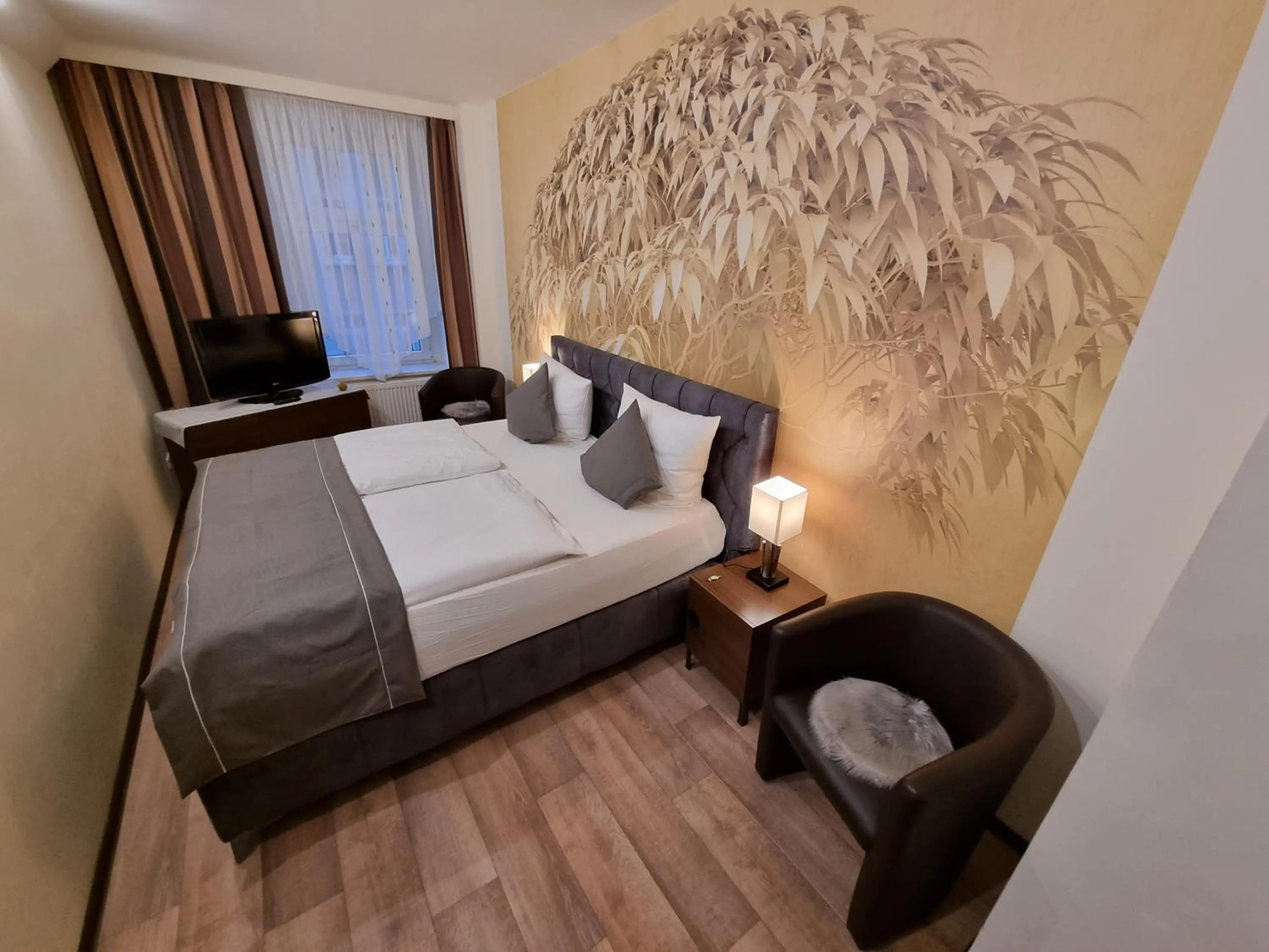 Photo of the whole room, Bed in Auenwald Hotel und Apartmenthaus