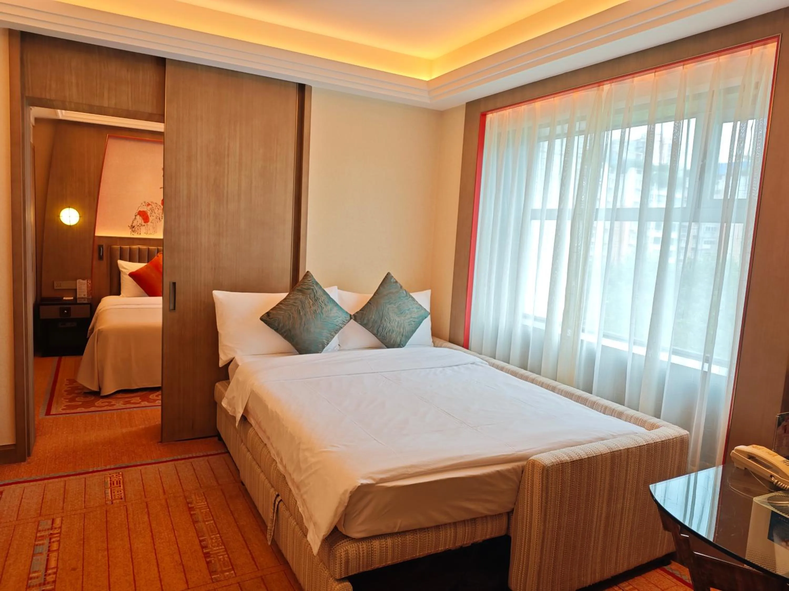 Living room, Bed in Chengdu Tibetan Hotel