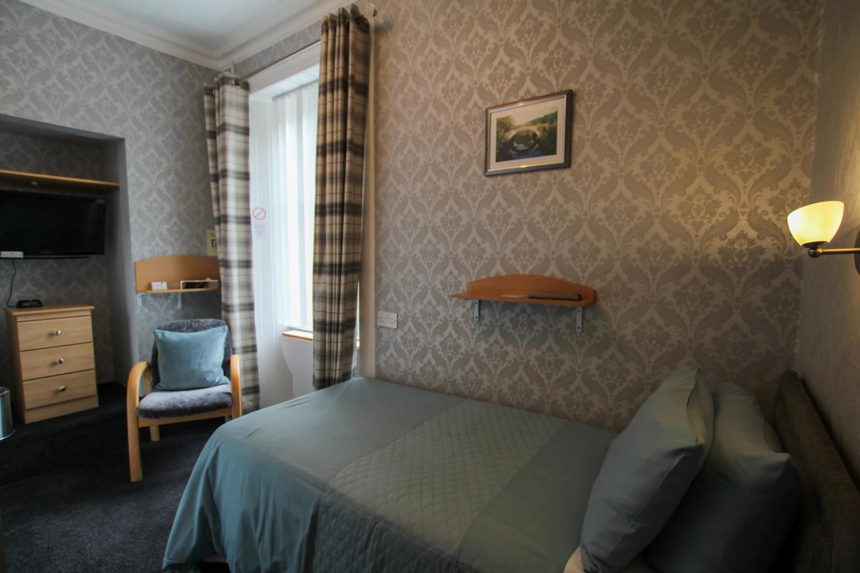 Bed in Dunallan Guest House