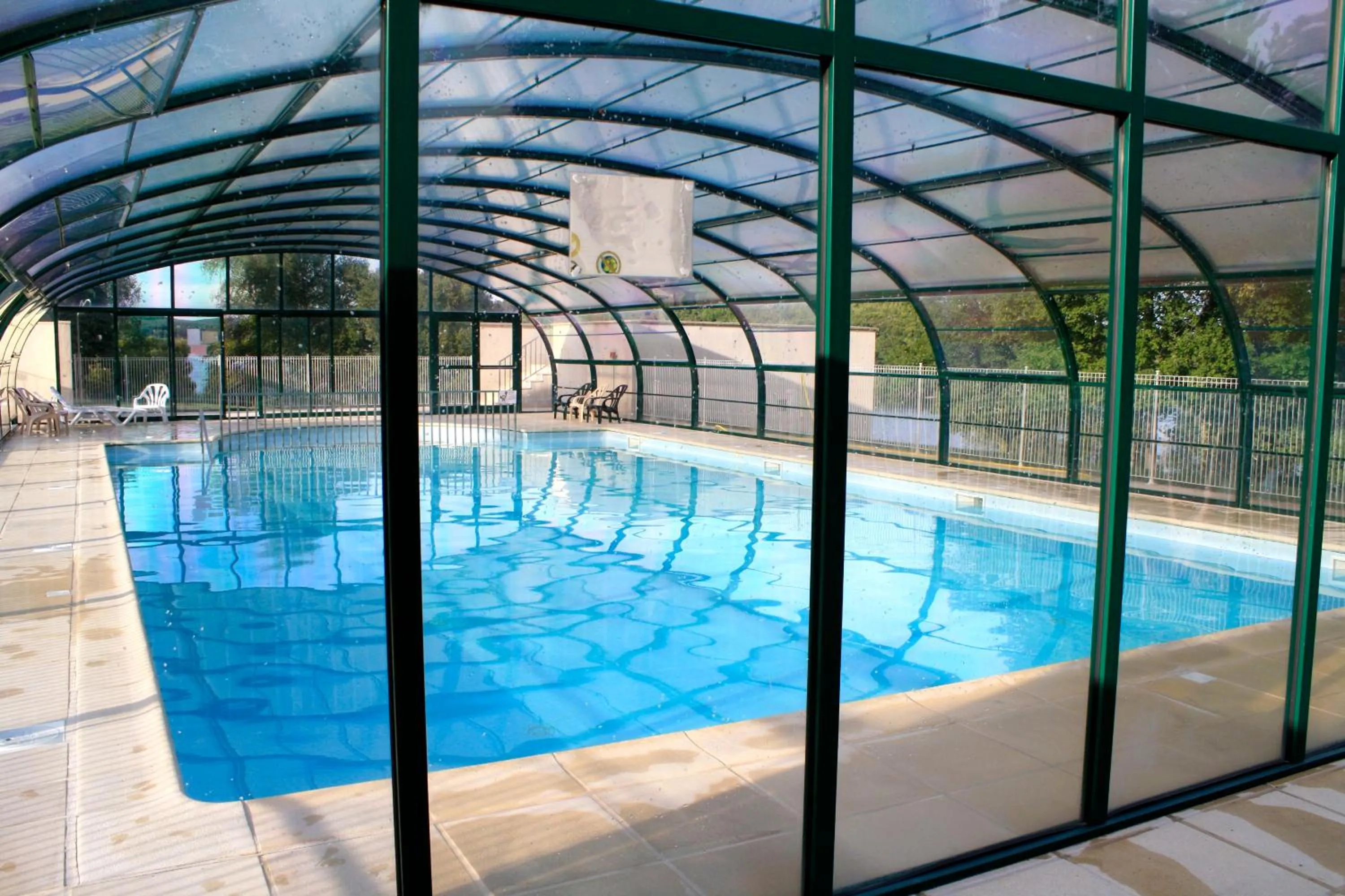 Swimming pool in Village vacances du Haut-Bréda aux 7 Laux