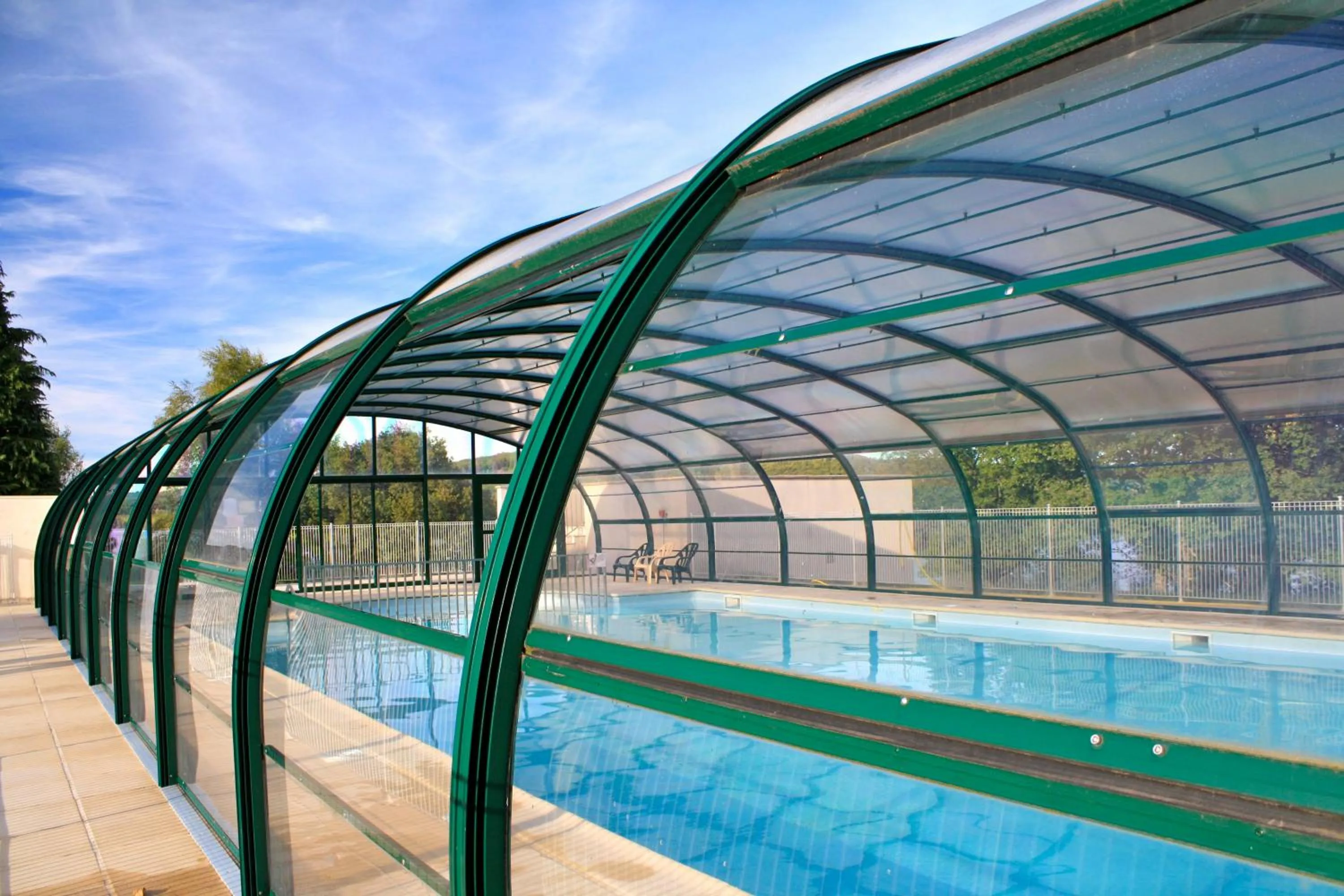 Swimming pool in Village vacances du Haut-Bréda aux 7 Laux