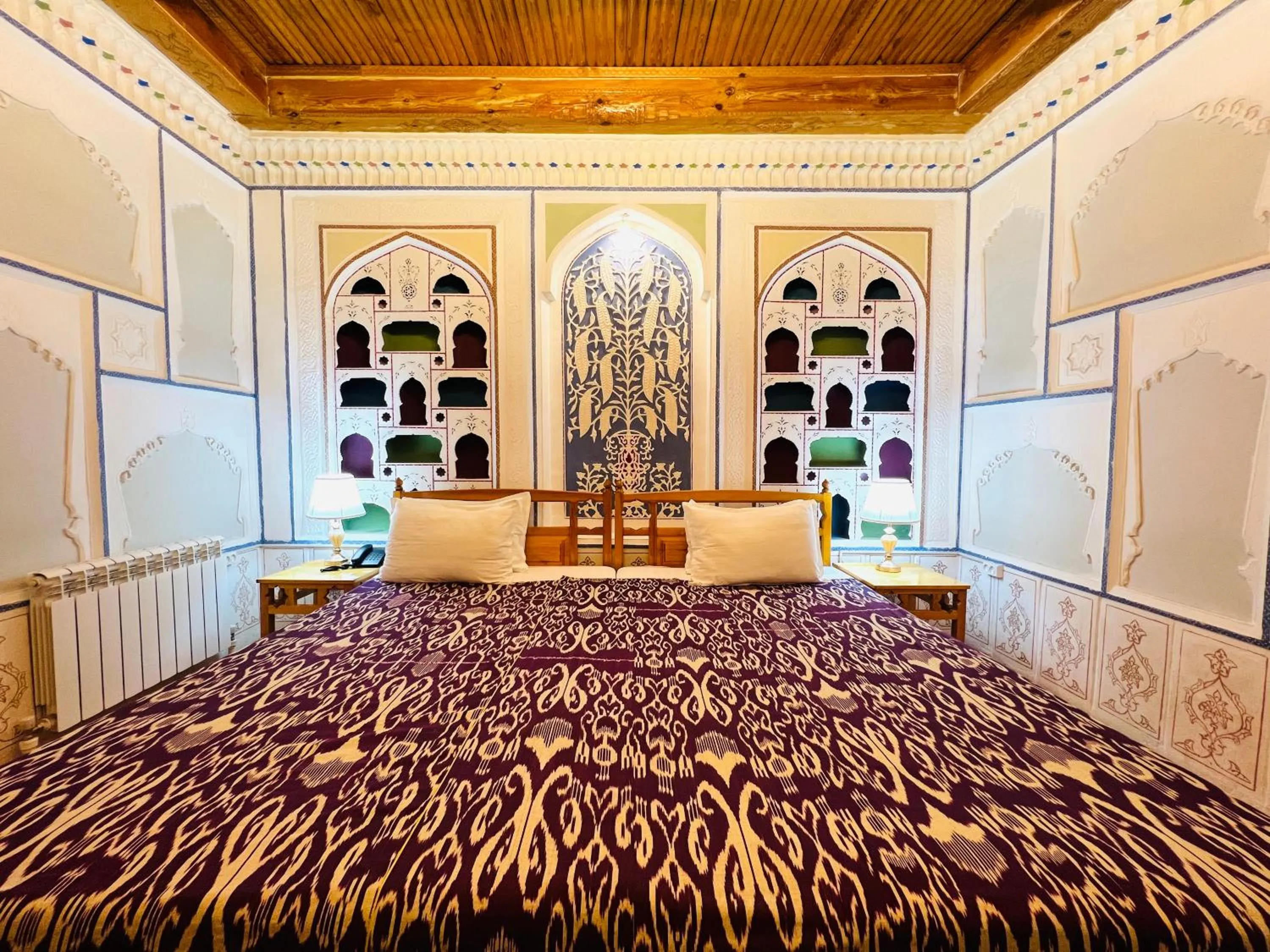 Bed in Komil Bukhara Boutique Hotel