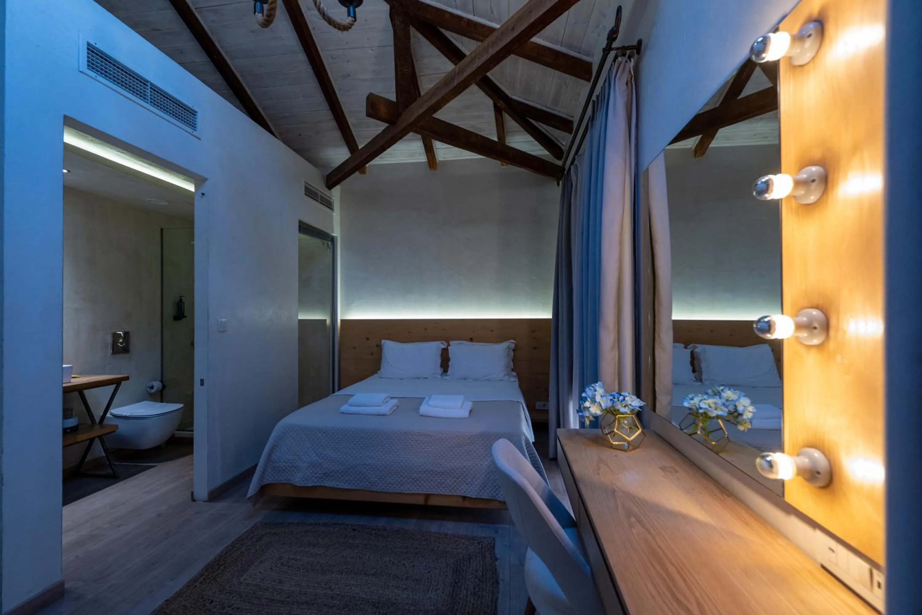 Bed in Panellinion Luxury Rooms