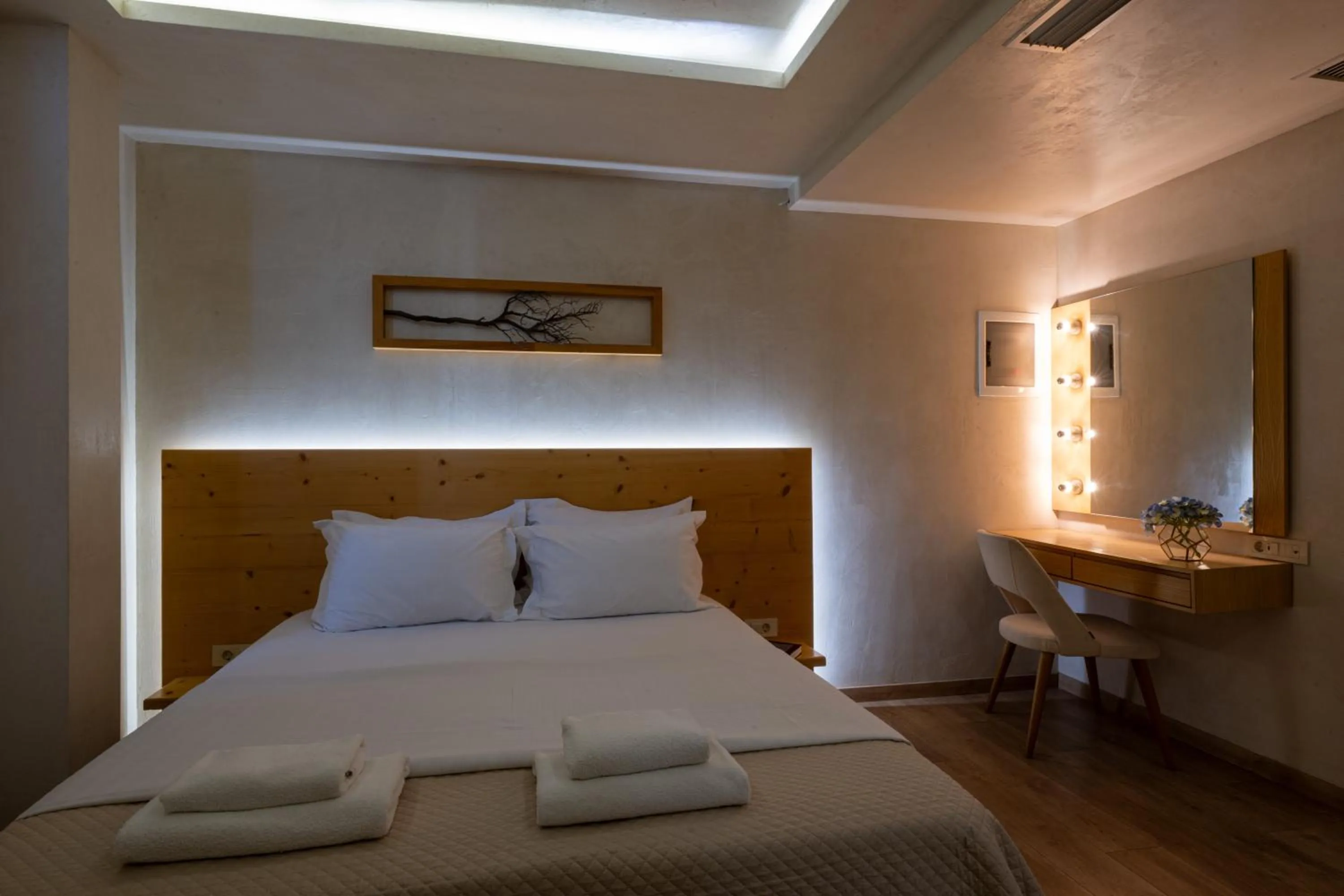 Bed in Panellinion Luxury Rooms