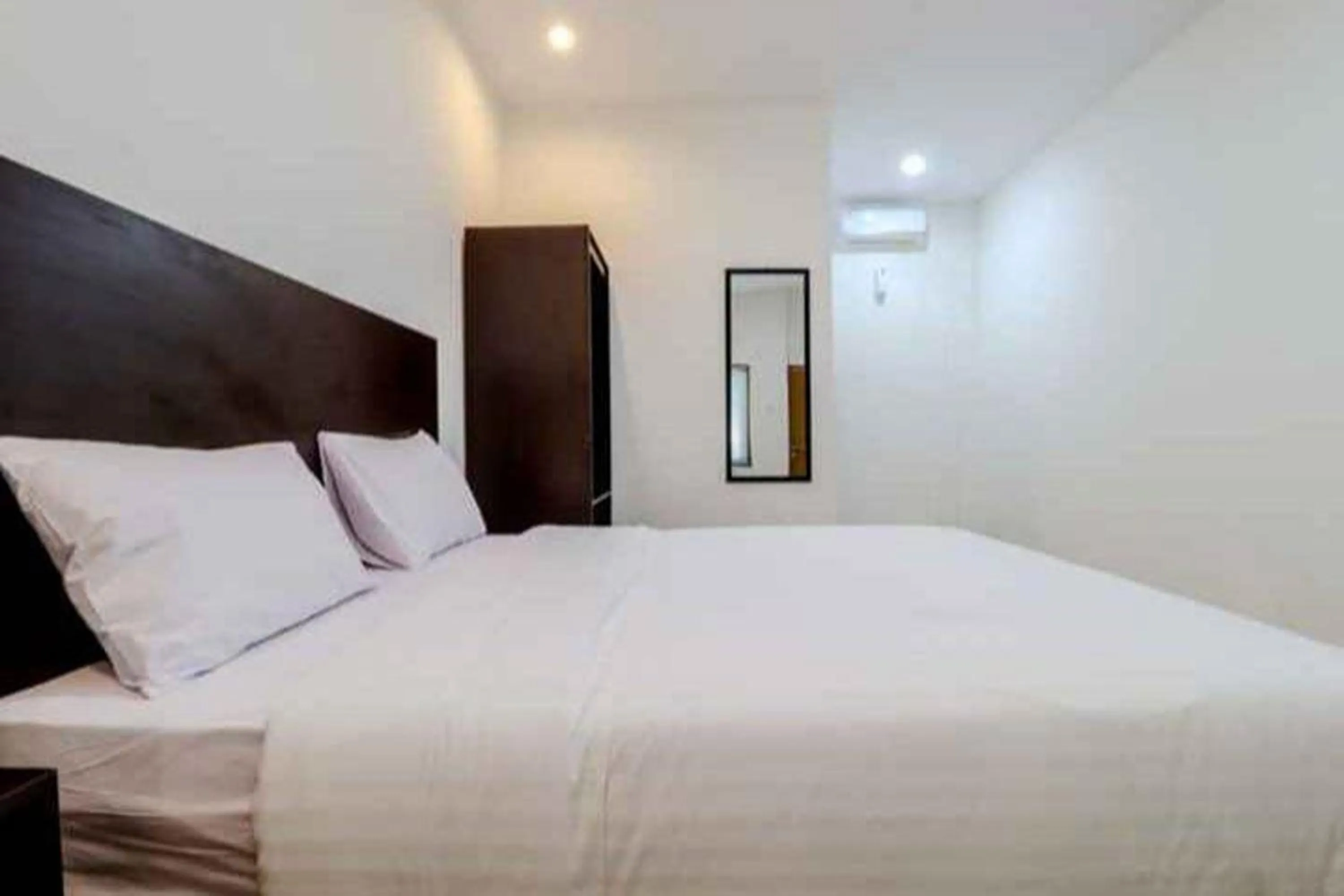 Bed in Hotel Sumaryo