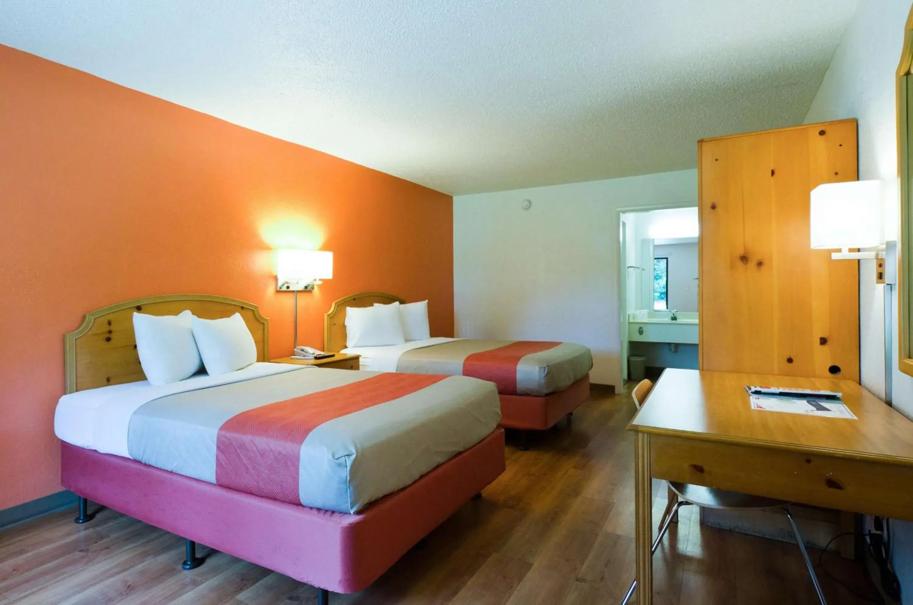 Seating area, Bed in Motel 6-Frederick, MD - Fort Detrick