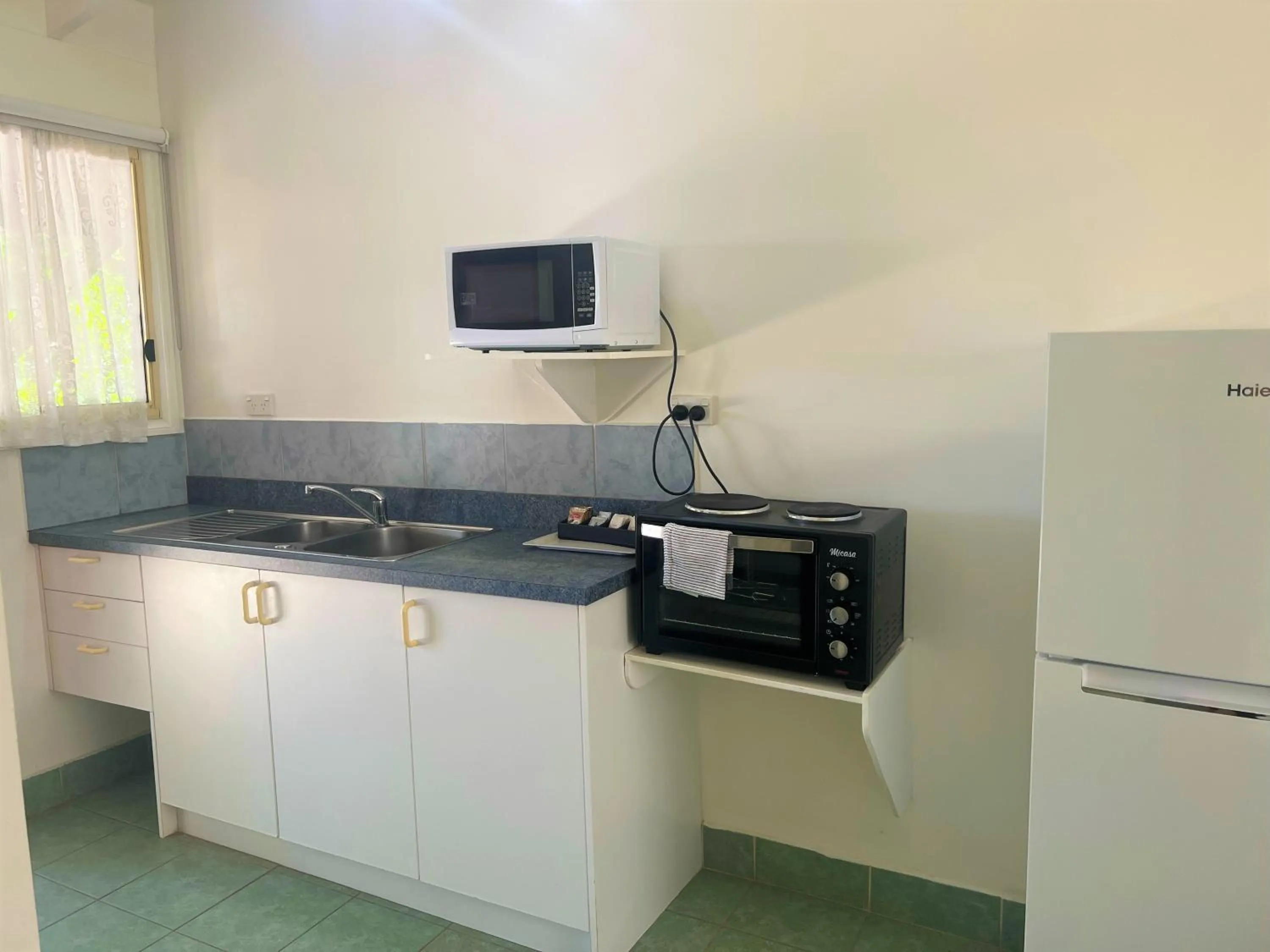 Kitchen or kitchenette in Club Raro Resort- Adults Only