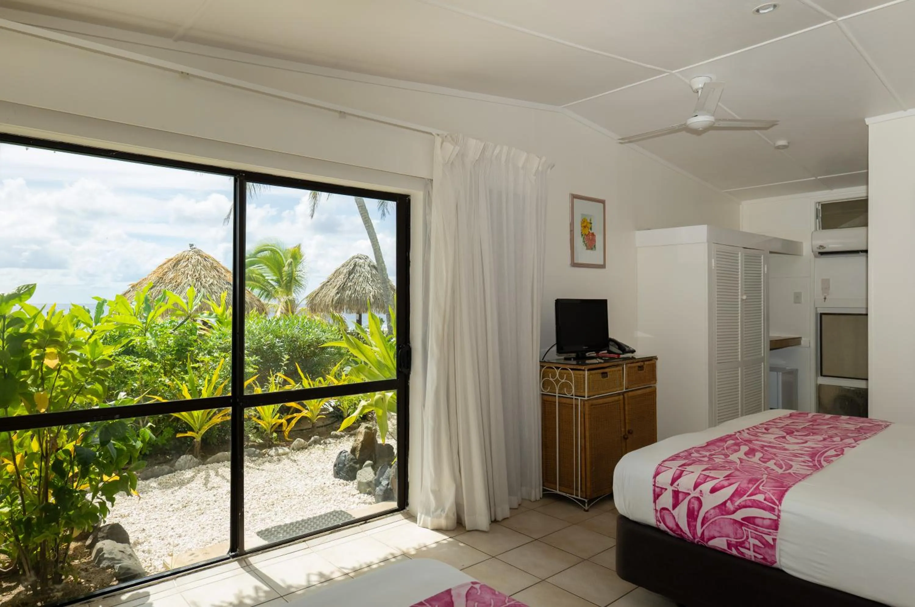 Photo of the whole room, Bed in Club Raro Resort- Adults Only