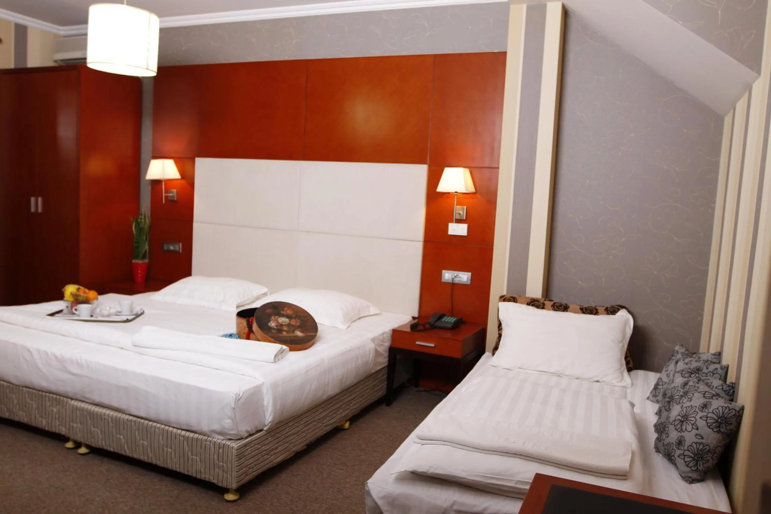 Bed in Bel Conti Hotel